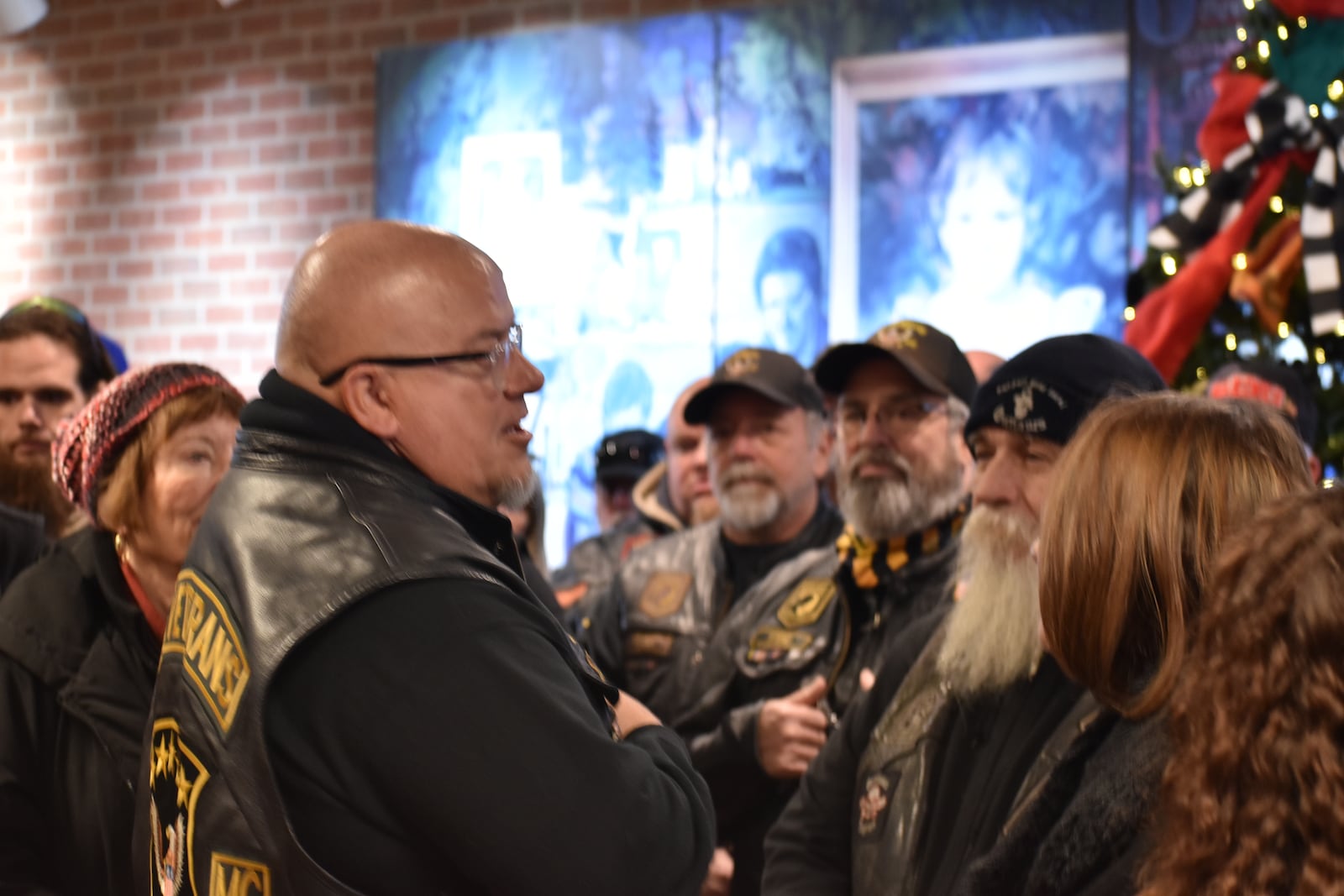 Keith "Elmo" Tickle, of Dayton and a member of the U.S. Veterans Motorcycle Club, addresses members of the Ohio State Coalition of Clubs (Ohio State COC) after they delivered more than $10,000 in holiday presents to Montgomery County Children Services on Sunday, Dec. 1. Caseworkers will distribute gifts to children of all ages who are in Montgomery County’s care during the holidays. SAM WILDOW/STAFF