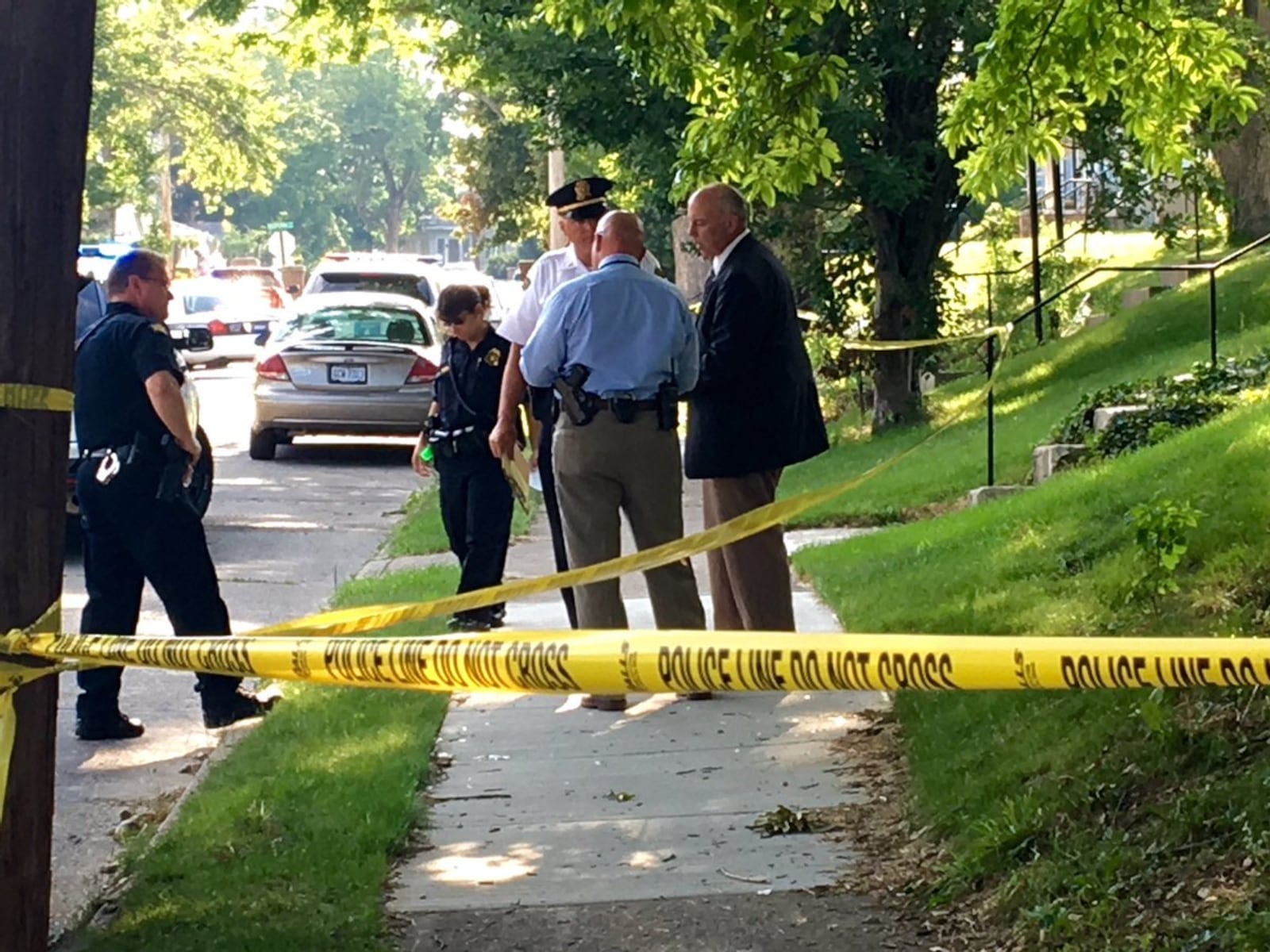 Police investigating a double shooting Saturday evening, June 26, 2016, on Kenwood Avenue in Dayton. (Caroline Reinwald/Staff)