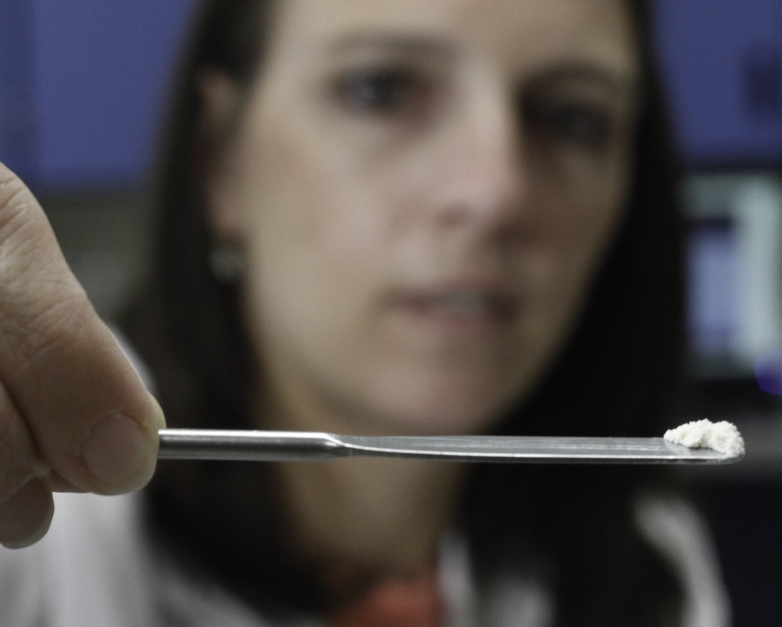 Brooke Ehlers, technical leader of the Miami Valley Regional Crime Laboratory’s Chemistry Section, tests a drug sample for fentanyl. The highly potent synthetic opioid — often cut with heroin or used alone — has been on the streets for more than a year in the Dayton area and is responsible for an increasing number of overdose deaths. CHRIS STEWART / STAFF