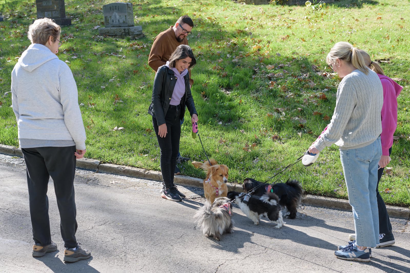 Dogs and their owners attended a guided history tour of Woodland Cemetery & Arboretum, located at 118 Woodland Ave. in Dayton on Saturday, Apr. 13, 2024. Volunteers with SICSA Pet Adoption and Wellness Center were on hand to provide information about their organization. Attendees who made a cash donation to SICSA received a raffle ticket to be entered to win a pet gift basket. TOM GILLIAM / CONTRIBUTING PHOTOGRAPHER