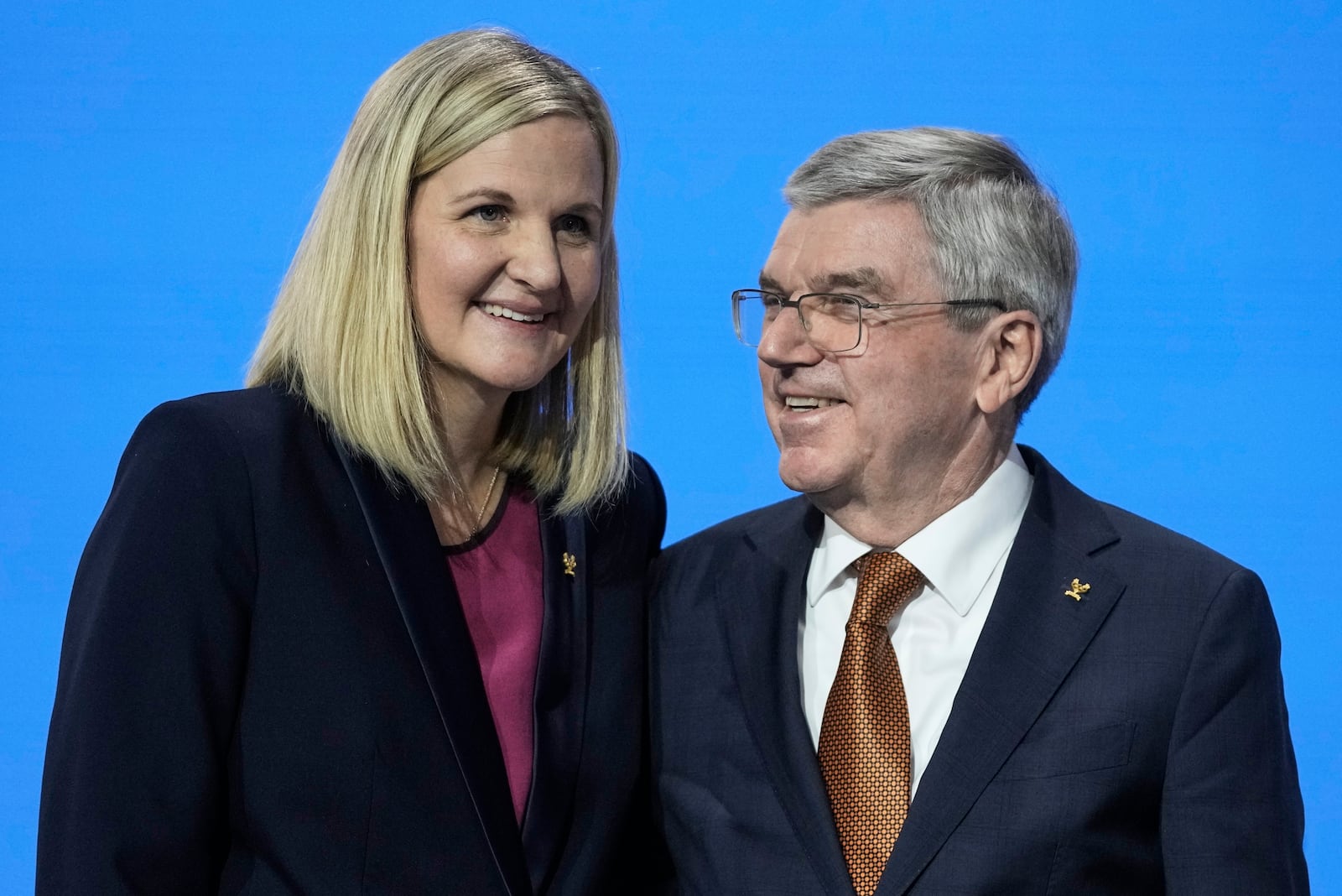 IOC President Thomas Bach, right, greets Kirsty Coventry after she was announced as the new IOC President at the International Olympic Committee 144th session in Costa Navarino, western Greece, Thursday, March 20, 2025. (AP Photo/Thanassis Stavrakis)