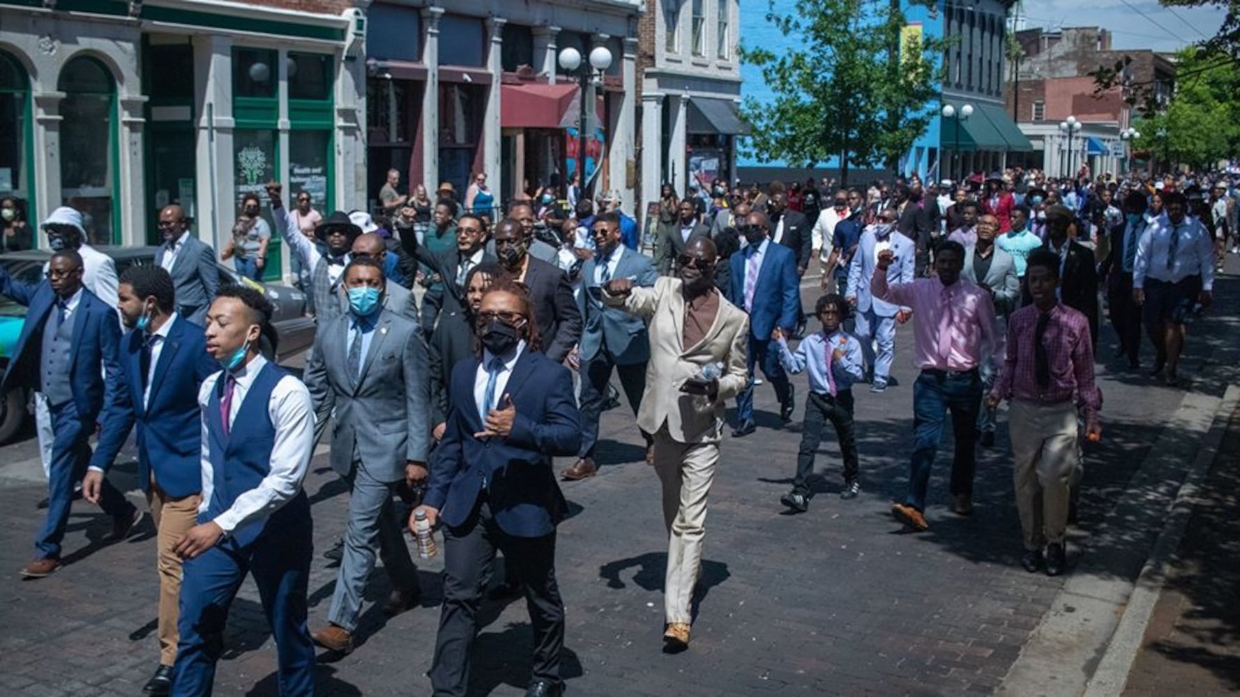 Photos: 300 men in suits march in Dayton