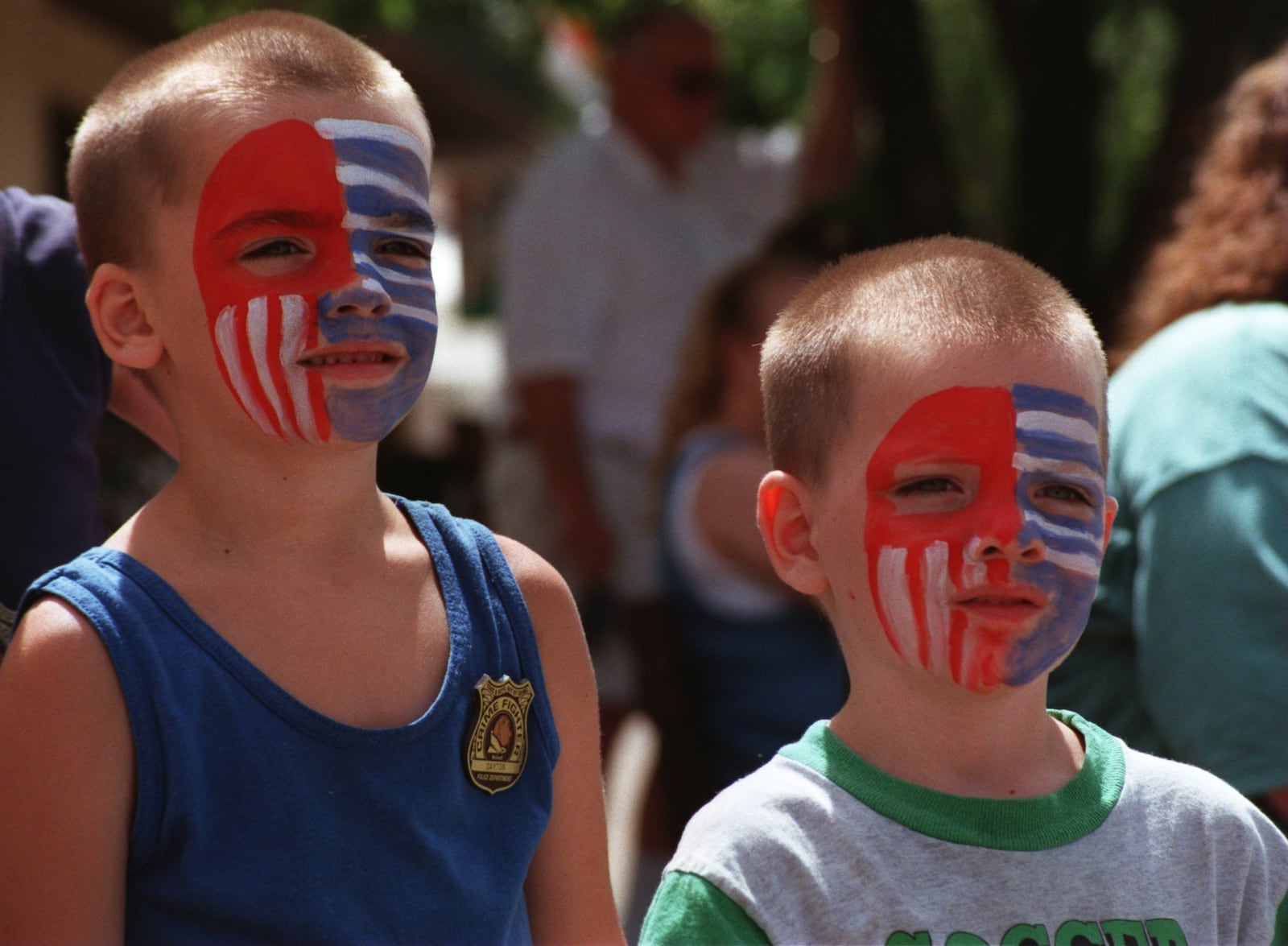 With their faces painted patriotically, Paul Harris, 5, and his brother Robby Harris, 4, watch the Belmont Days parade on July 30, 1998. DAYTON DAILY NEWS ARCHIVES.