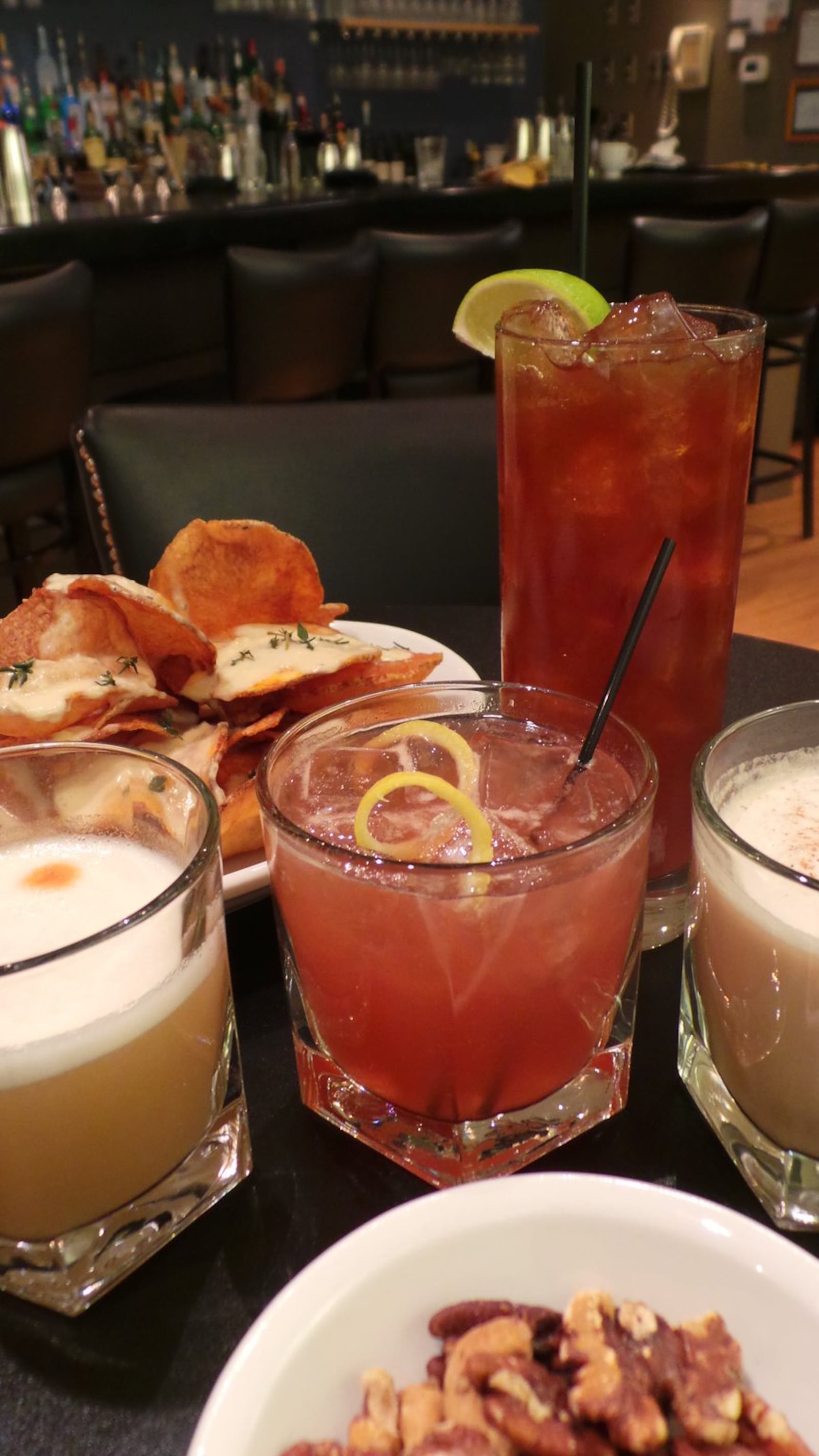 Meadowlark is just one of many local restaurants serving up delicious seasonal cocktails. Here are four standouts at the restaurant pictured right to left: Kentucky Flip, That Time of Day, Apple Smash and Amaretto Sour Our Way served alongside the restaurant’s house-made potato chips and bar nuts. CONTRIBUTED BY ALEXIS LARSEN