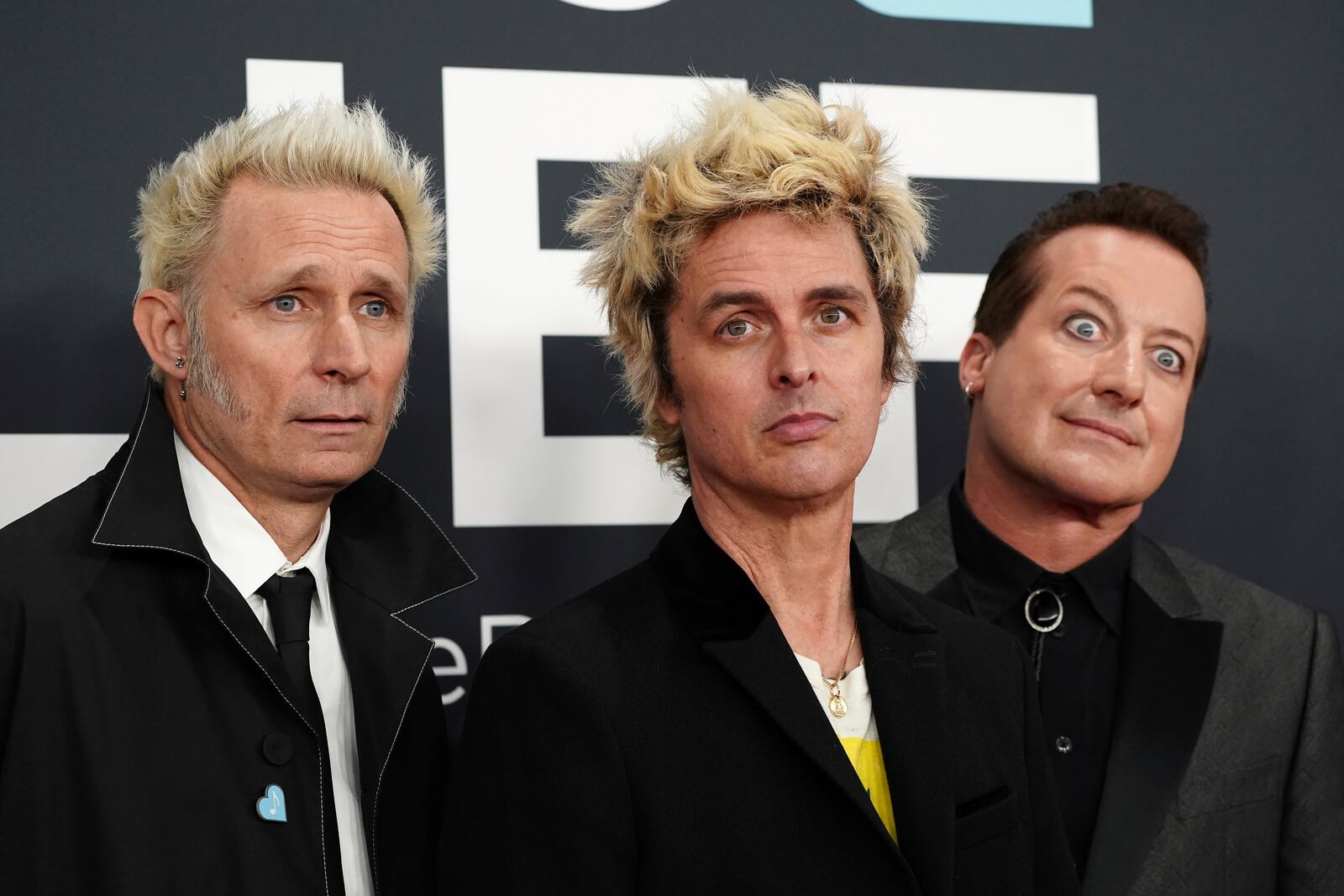 Mike Dirnt, from left, Billie Joe Armstrong, and Tre Cool of 'Green Day' arrive at the 67th annual Grammy Awards on Sunday, Feb. 2, 2025, in Los Angeles. (Photo by Jordan Strauss/Invision/AP)