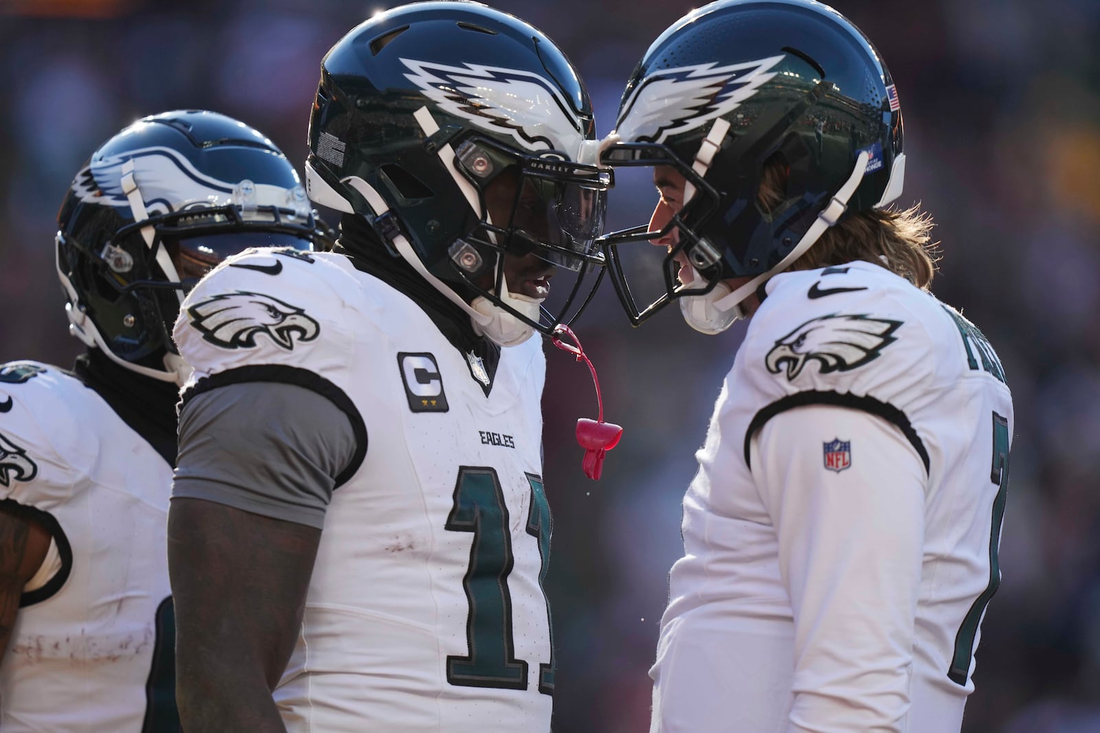 Philadelphia Eagles wide receiver A.J. Brown (11) celebrating his touchdown with teammate quarterback Kenny Pickett (7) during the first half of an NFL football game, Sunday, Dec. 22, 2024, in Landover, Md. (AP Photo/Stephanie Scarbrough)