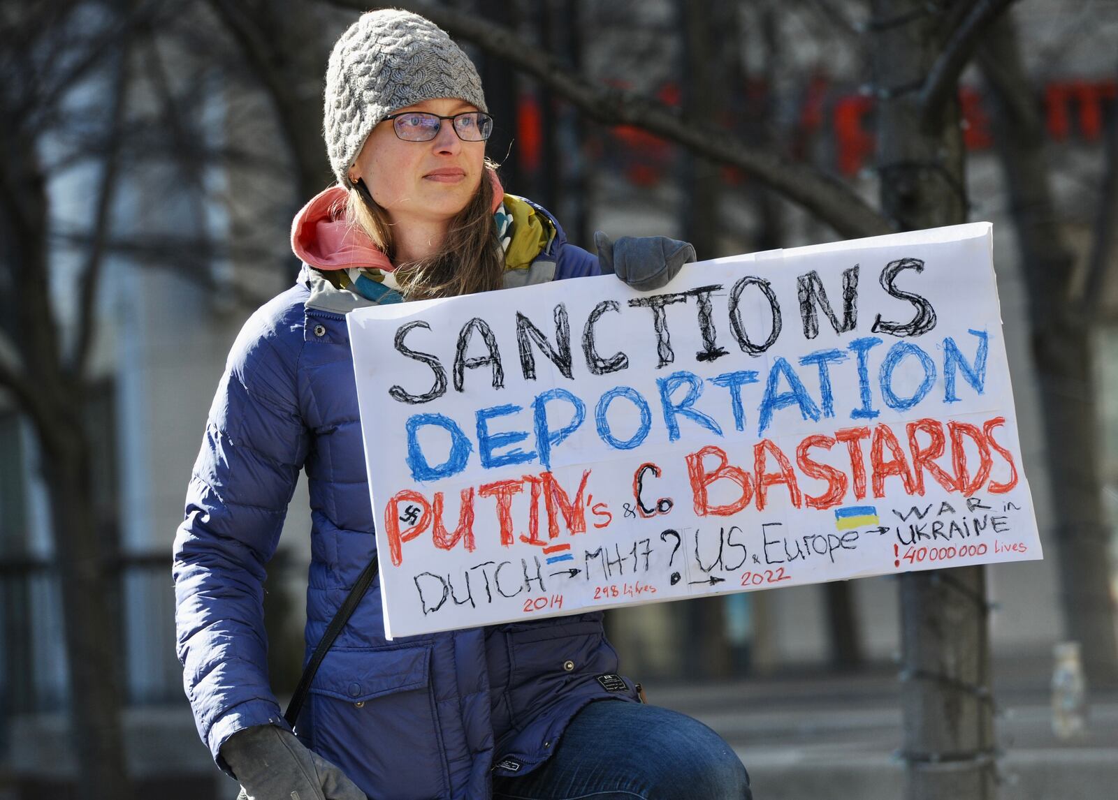 Nataliia Olefir attends a rally at Courthouse Square to show support for the Ukraine Sunday. MARSHALL GORBY\STAFF