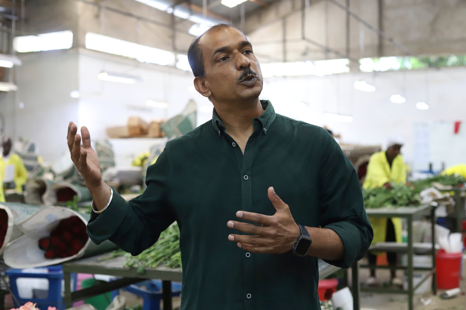 Anantha Kumar, head of marketing Isinya Roses Limited - Porini Flowers, speaks during an interview with The Associated Press in Kajiado County, Kenya Friday, Feb. 7, 2025. (AP Photo/Andrew Kasuku)