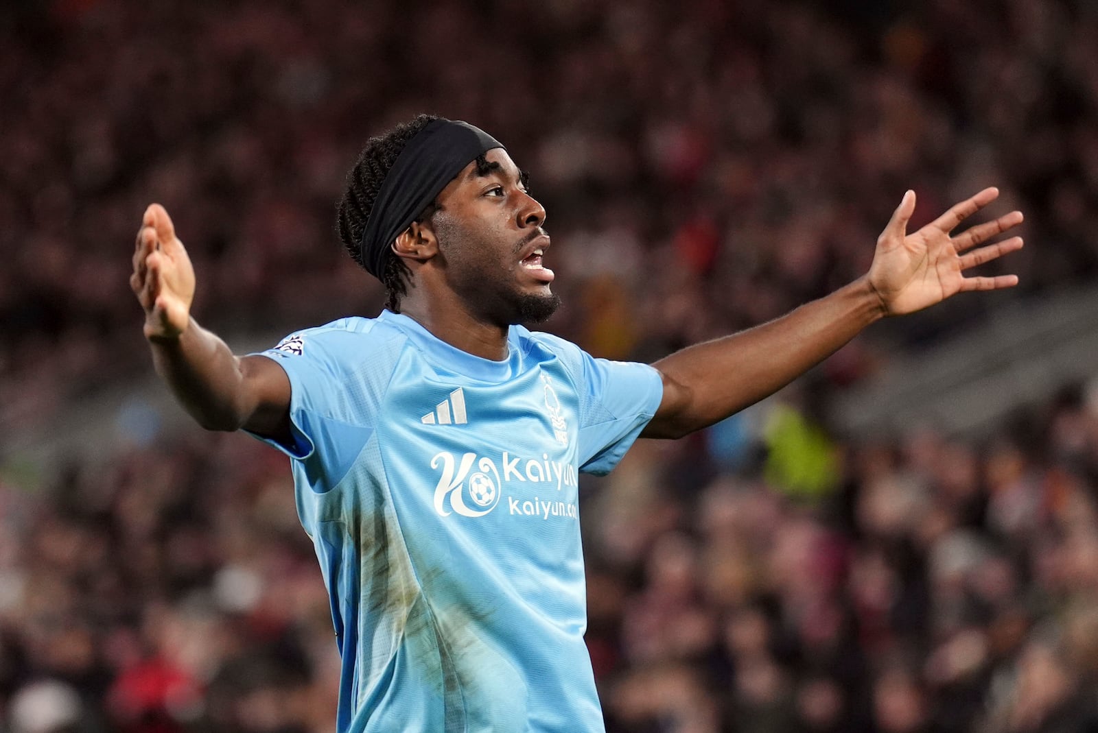 Nottingham Forest's Anthony Elanga, right, celebrates after scoring his sides second goal during during the English Premier League soccer match between Brentford and Nottingham Forest at the Gtech Community Stadium, London, Saturday Dec. 21, 2024. (John Walton/PA via AP)