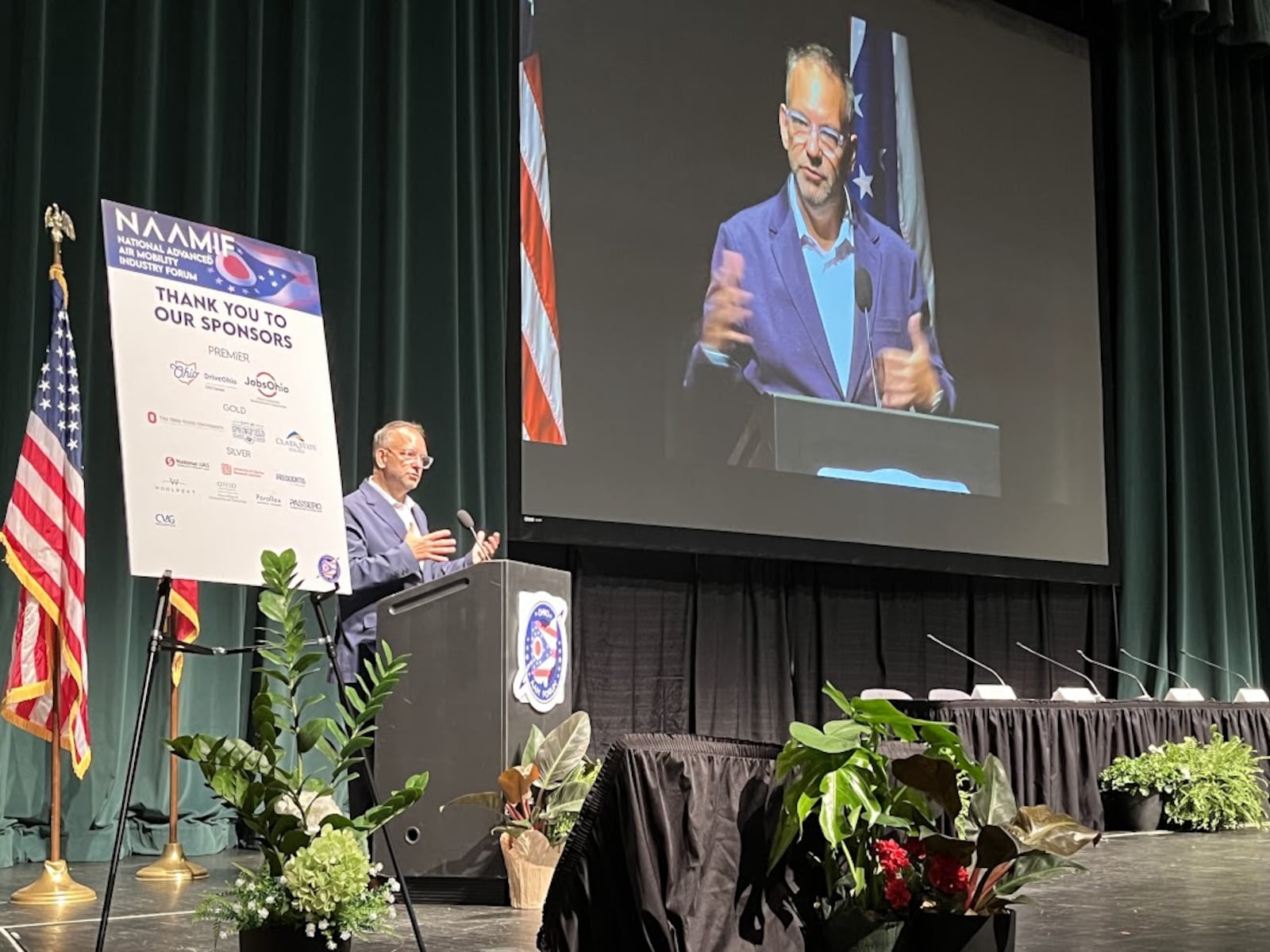 Greg Bowles, head of government policy and regulatory affairs for Joby Aviation, speaking Tuesday at the National Advanced Air Mobility Industry Forum at Clark State Community College in Springfield. THOMAS GNAU/STAFF.