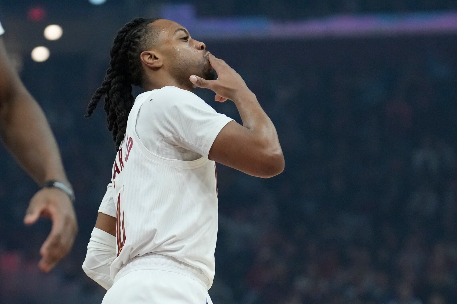 Cleveland Cavaliers guard Darius Garland celebrates after a 3-point basket in the first half of an NBA basketball game against the Dallas Mavericks, Sunday, Feb. 2, 2025, in Cleveland. (AP Photo/Sue Ogrocki)