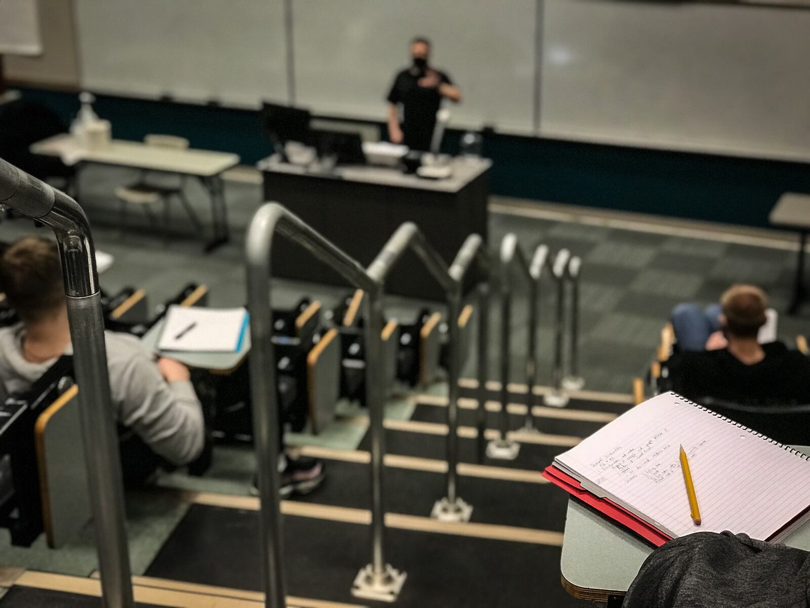 Wright State University students listen to a economics lecture from Professor Kevin Willardsen. Wright State University has a $1.5 billion impact on the region. The university is also planning 113 faculty cuts. Jim Noelker STAFF