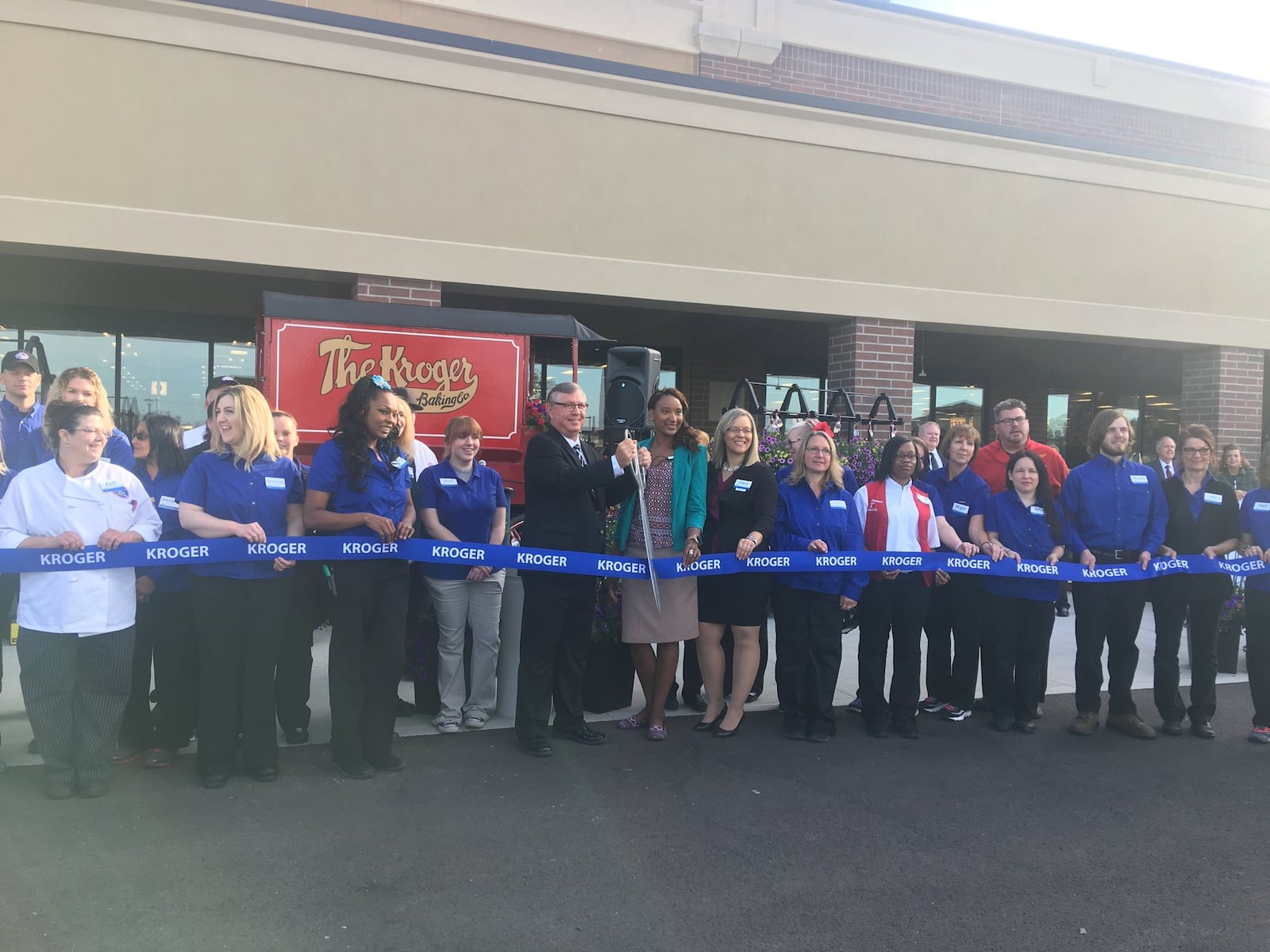 Kroger officials celebrate the opening of the Cornerstone of Centerville store with a ribbon-cutting ceremony. KARA DRISCOLL/STAFF