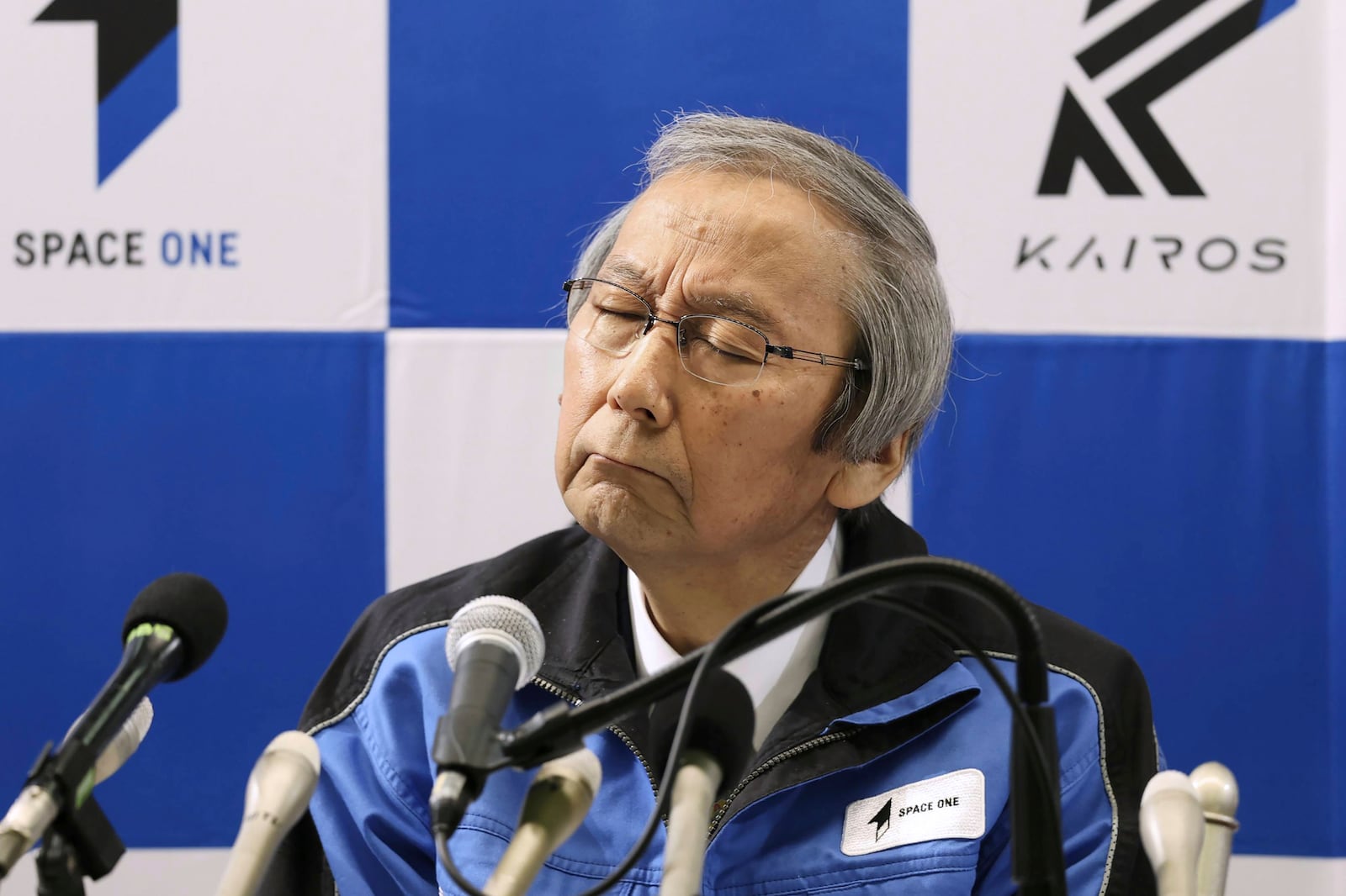 Space One President Masakazu Toyoda reacts during a press conference after its second attempt to launch the Kairos No. 2 rocket carrying satellites into orbit had been aborted minutes after liftoff, in Kushimoto town, western Japan Wednesday, Dec. 18, 2024.(Kyodo News via AP)