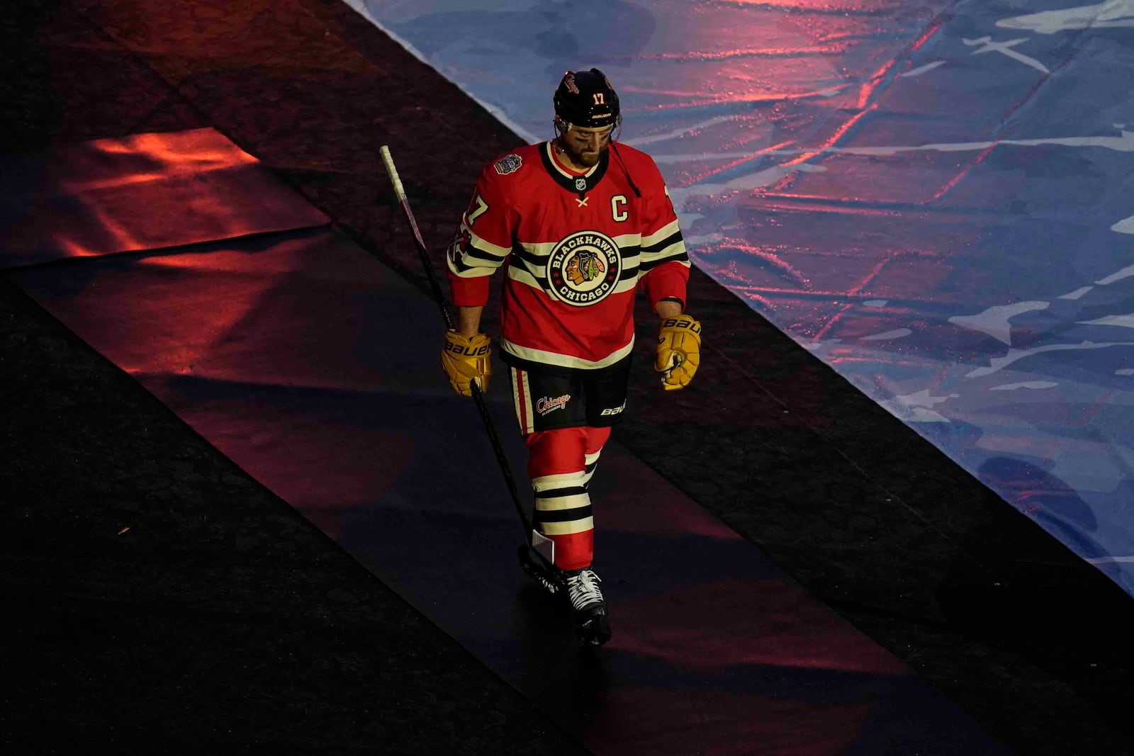 Chicago Blackhawks left wing Nick Foligno (17) takes the ice for the NHL Winter Classic outdoor hockey game featuring the Blackhawks and St. Louis Blues at Wrigley Field, Tuesday, Dec. 31, 2024, in Chicago. (AP Photo/Erin Hooley)