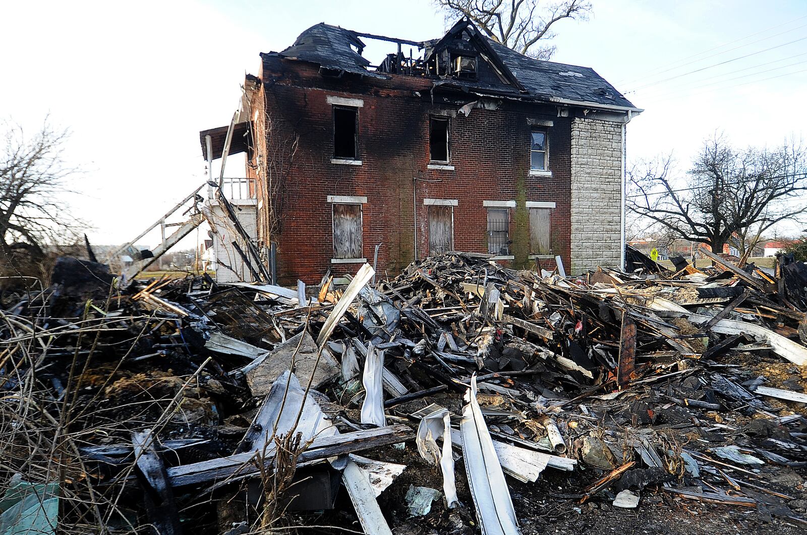 Demolition continues Thursday March 9, 2023 after massive North Broadway Street fire Wednesday morning. A total of five people’s bodies were found in the debris. MARSHALL GORBY\STAFF