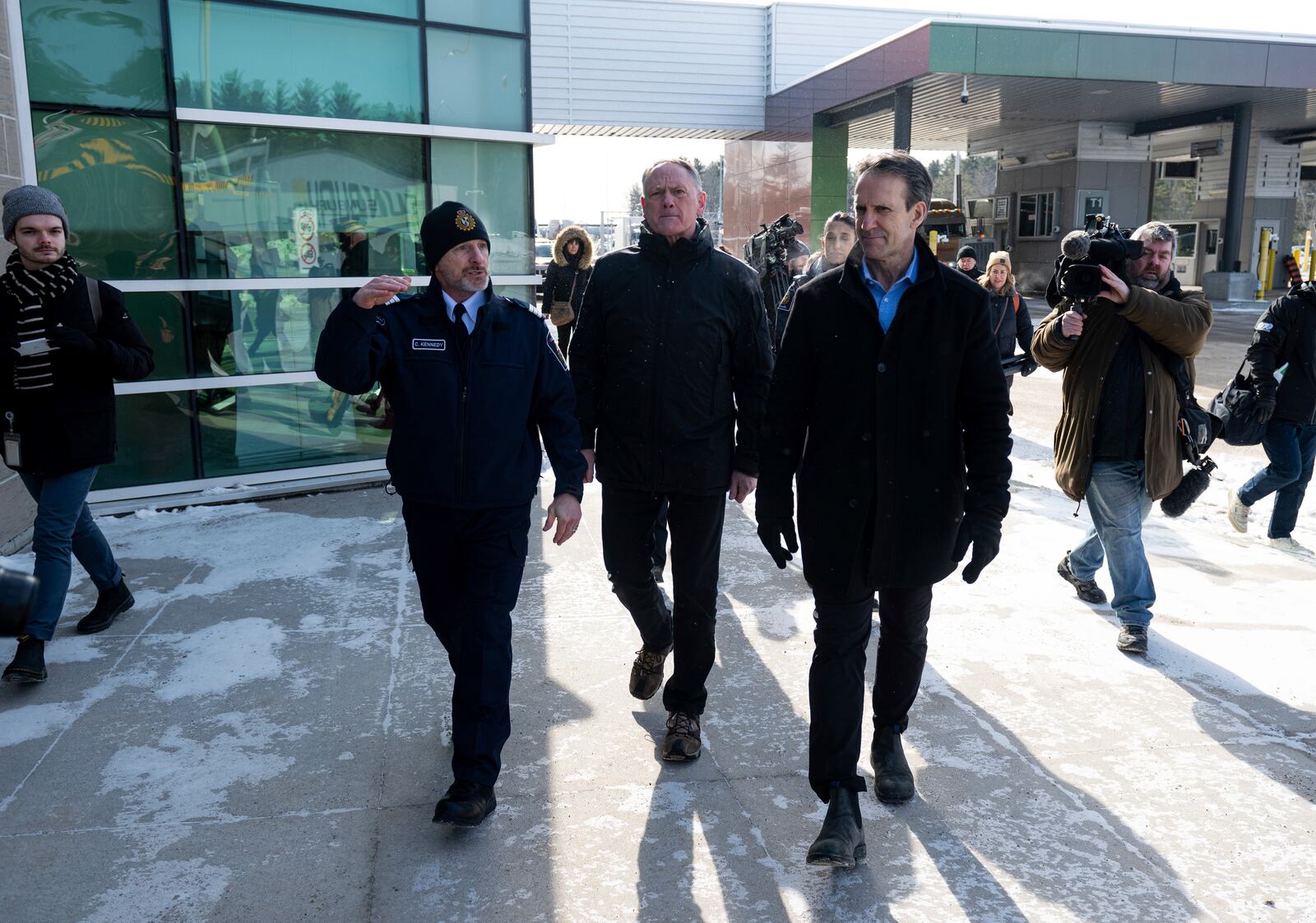 Minister of Public Safety David McGuinty, center, and Canada's Fentanyl Czar Kevin Brosseau, right, are seen during a tour of the Canada Border Services Agency (CBSA) Lansdowne Port of Entry in Lansdowne, Ontario, on Wednesday, Feb. 12, 2025. (Spencer Colby/The Canadian Press via AP)