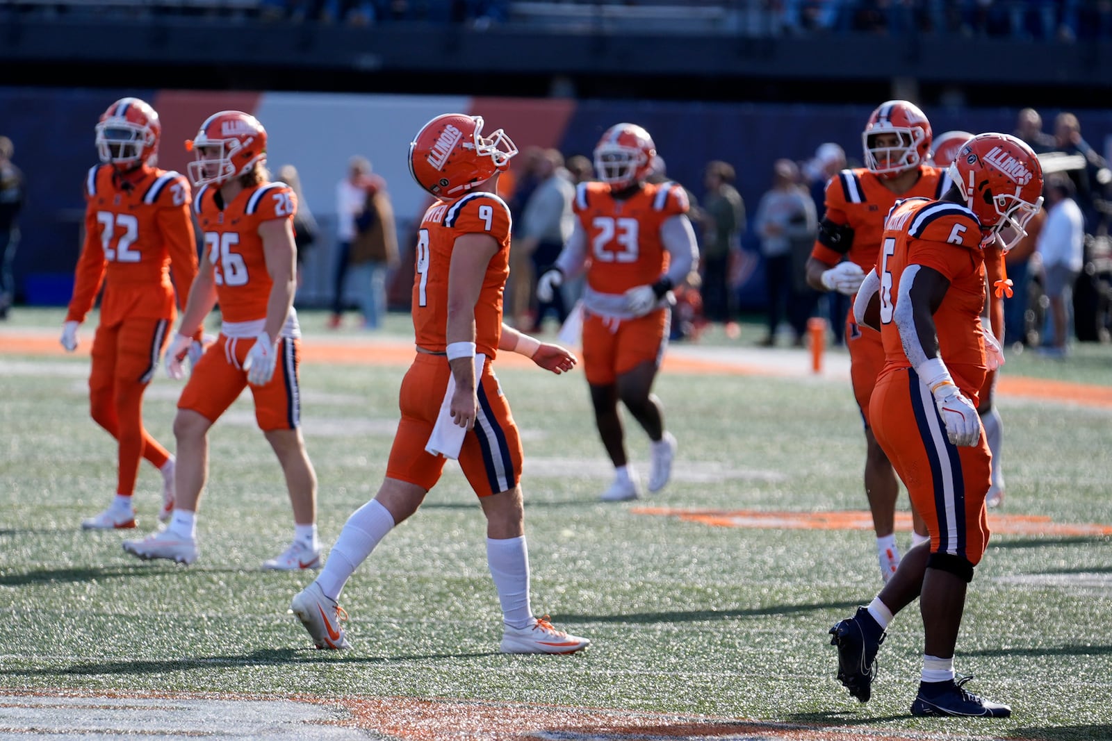 Illinois quarterback Luke Altmyer (9) walks off field after a fumble late in the fourth quarter of the team's 25-17 loss to Minnesota in an NCAA college football game Saturday, Nov. 2, 2024, in Champaign, Ill. (AP Photo/Charles Rex Arbogast)