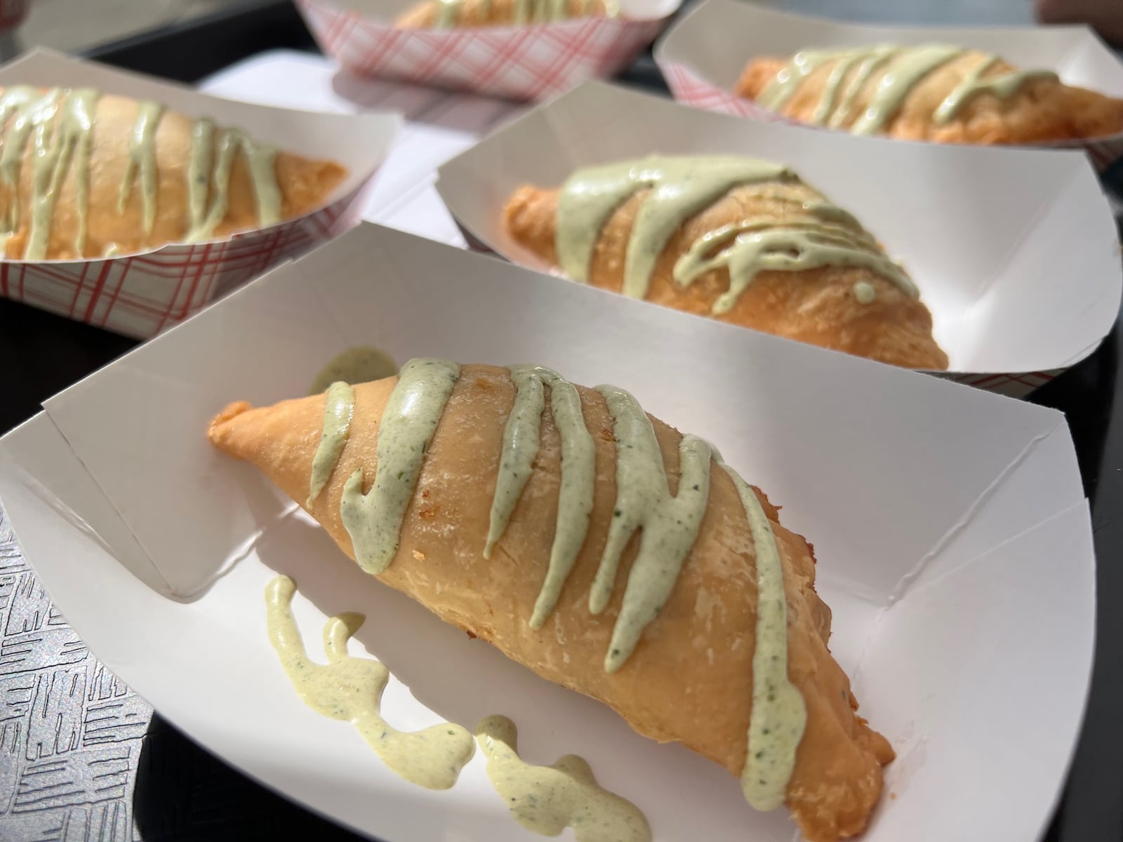 At the 2022 Bacon Fest, held Aug. 13 at Kettering's Fraze Pavilion, Coco's Bistro took home most creative dish with a savory pork belly and bacon empanada with a poblano sauce.