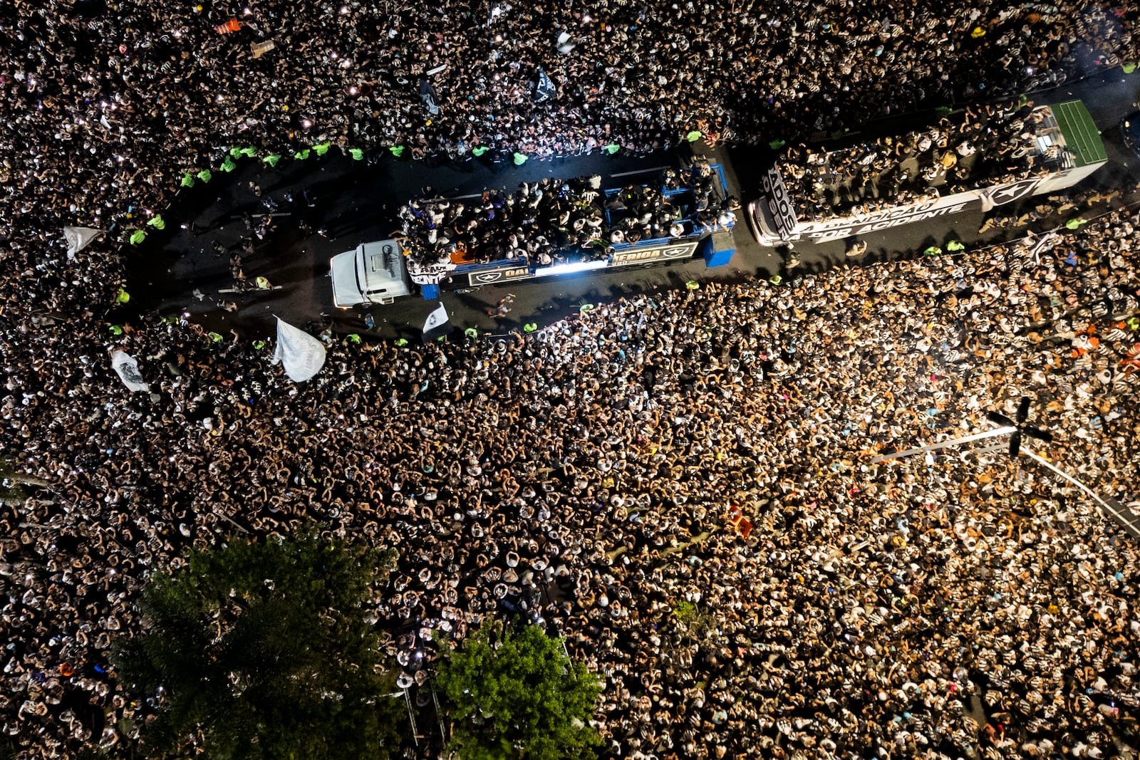 Players of Brazil's Botafogo parade through the streets on a truck during a homecoming celebration after winning the Copa Libertadores soccer tournament, in Rio de Janeiro, Sunday, Dec. 1, 2024. (AP Photo/Bruna Prado)