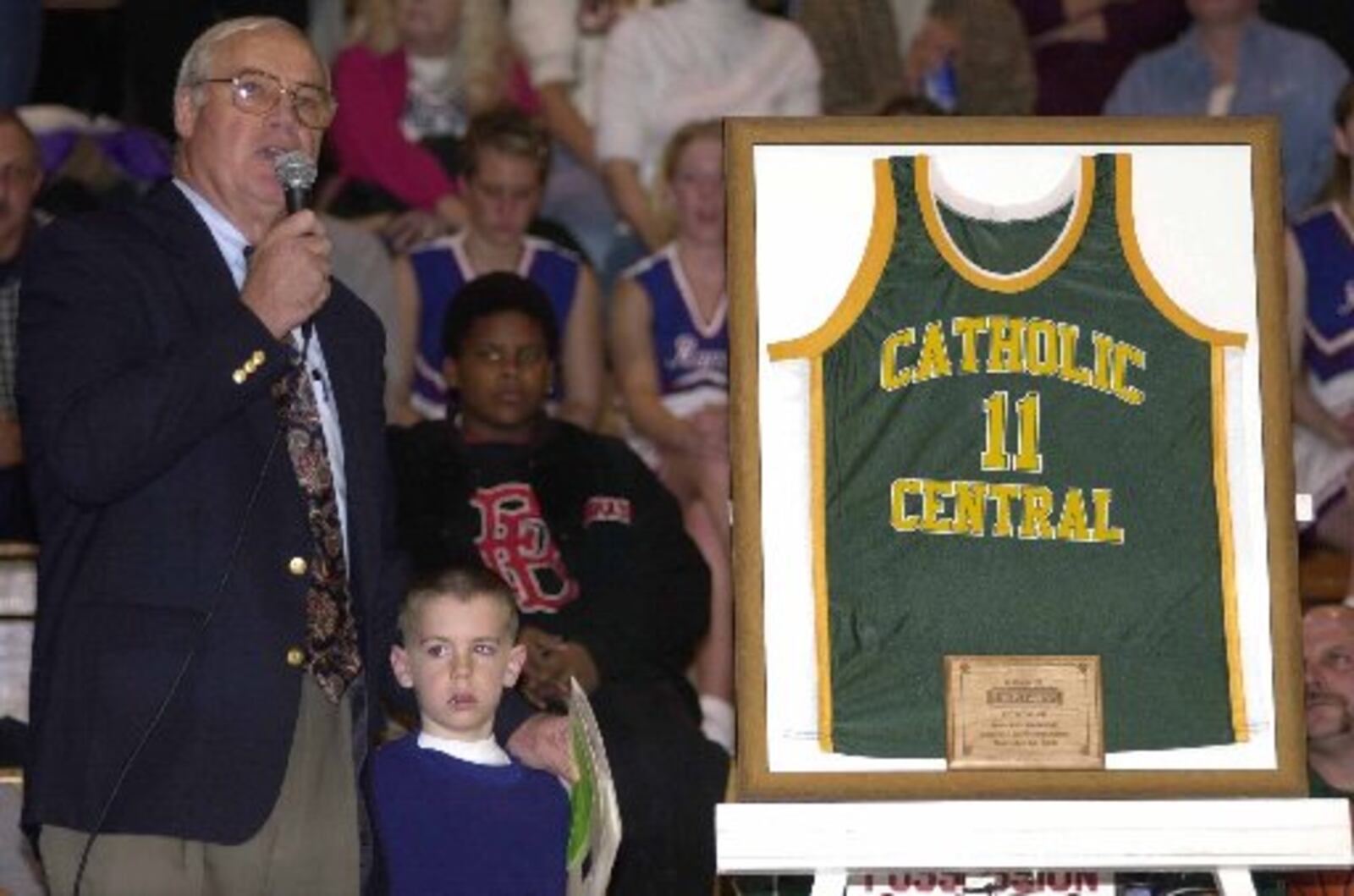 Catholic Central player Jim Paxson Sr. speaks to the crowd at Catholic Central on Dec. 1, 2000, as his jersey is retired in a special halftime ceremony. Jim Laskay/Staff