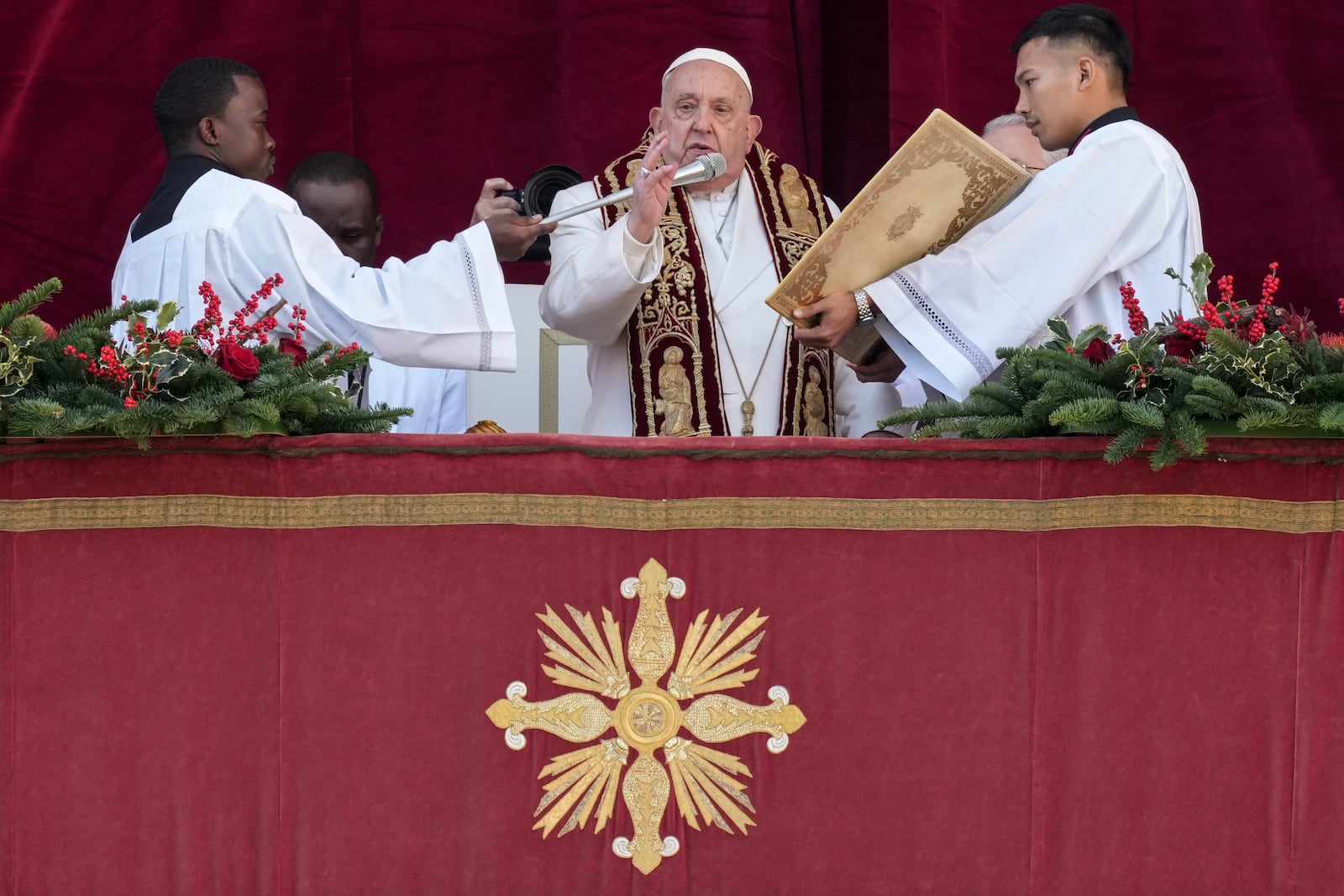 Pope Francis delivers the Urbi et Orbi (Latin for 'to the city and to the world' ) Christmas' day blessing from the main balcony of St. Peter's Basilica at the Vatican, Wednesday, Dec. 25, 2024. (AP Photo/Andrew Medichini)