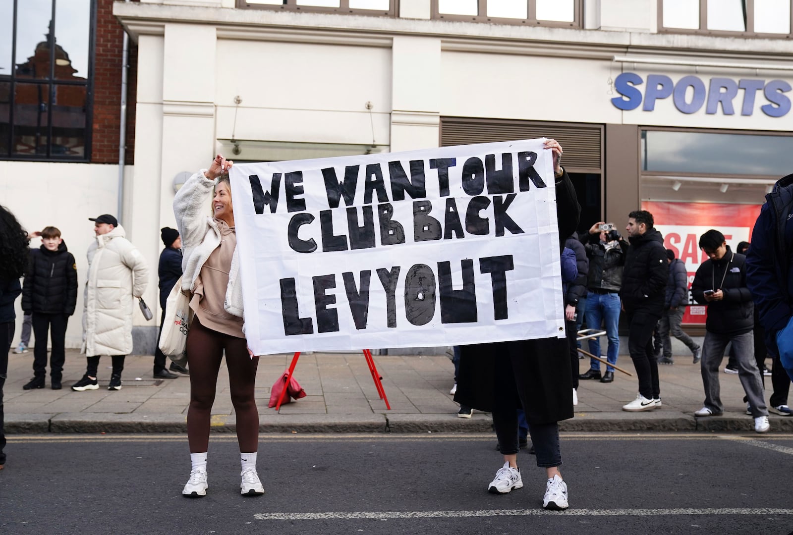 Tottenham Hotspur fans protest against the club owners ahead of the Premier League match between Tottenham and Manchester United at the Tottenham Hotspur Stadium, London, Sunday Feb. 16, 2025. (John Walton/PA via AP)