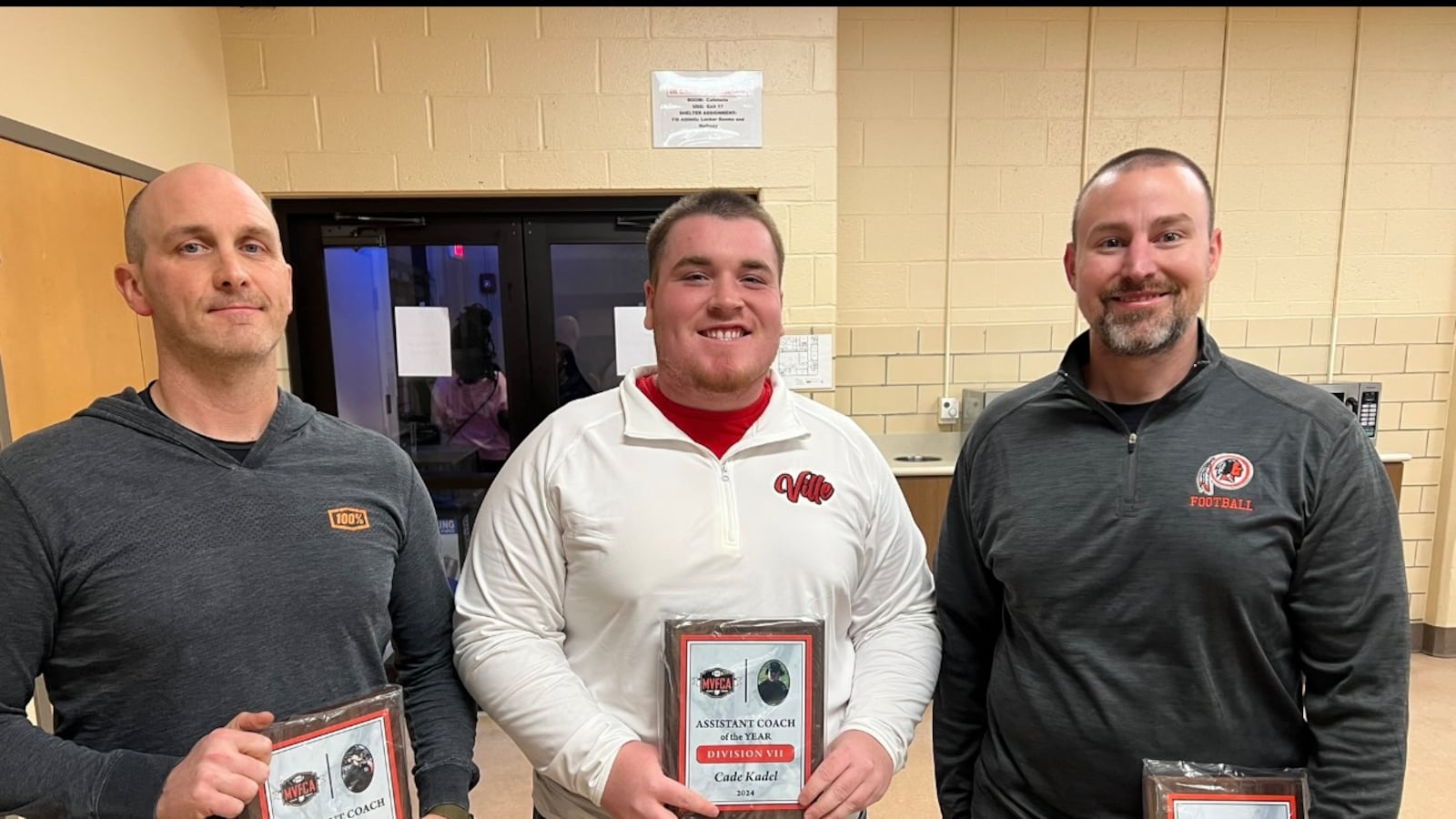 2024 Miami Valley Football Coaches Association coaches of the year Brian Bogenshutz (right), Cade Kadell and Paul Riffle