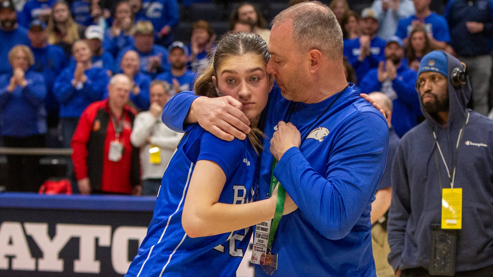 Bryn Martin gets her runner-up medal and a hug from her dad, Kyle Martin, the Springboro principal, after the Panthers lost to Olmsted Falls in the Division I state final Saturday night at UD Arena. Jeff Gilbert/CONTRIBUTED