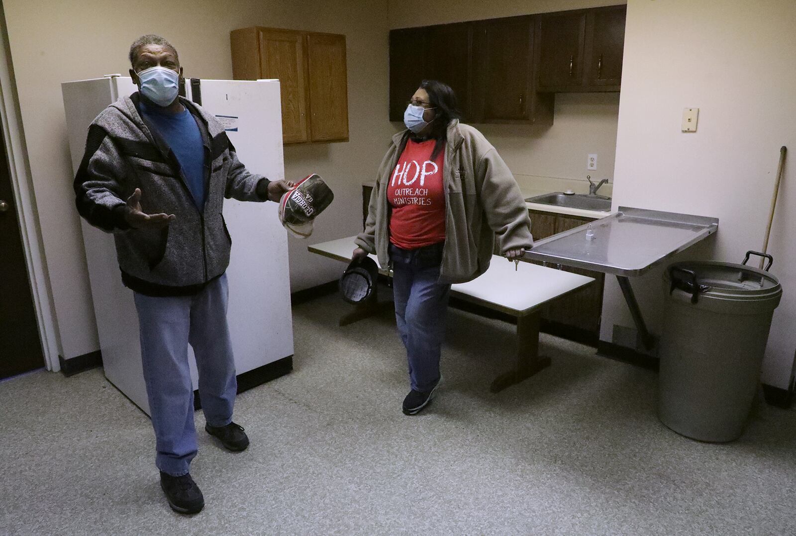 Alonzo McCoy, director of the HOP Outreach Ministries Food Pantry and Michelle Speaks talk about how they will utilize the space in the building that was donated to them for the winter. The building was donated by Dr. John Bruce at the Northwood Animal Hospital. BILL LACKEY/STAFF