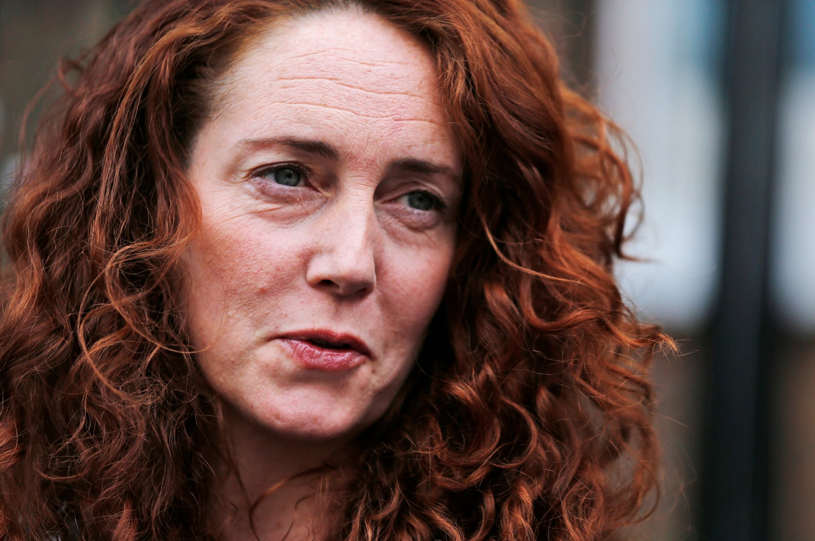 FILE - Rebekah Brooks, former News International chief executive, talks to members of the media in central London, Thursday, June 26, 2014. (AP Photo/Lefteris Pitarakis, File)