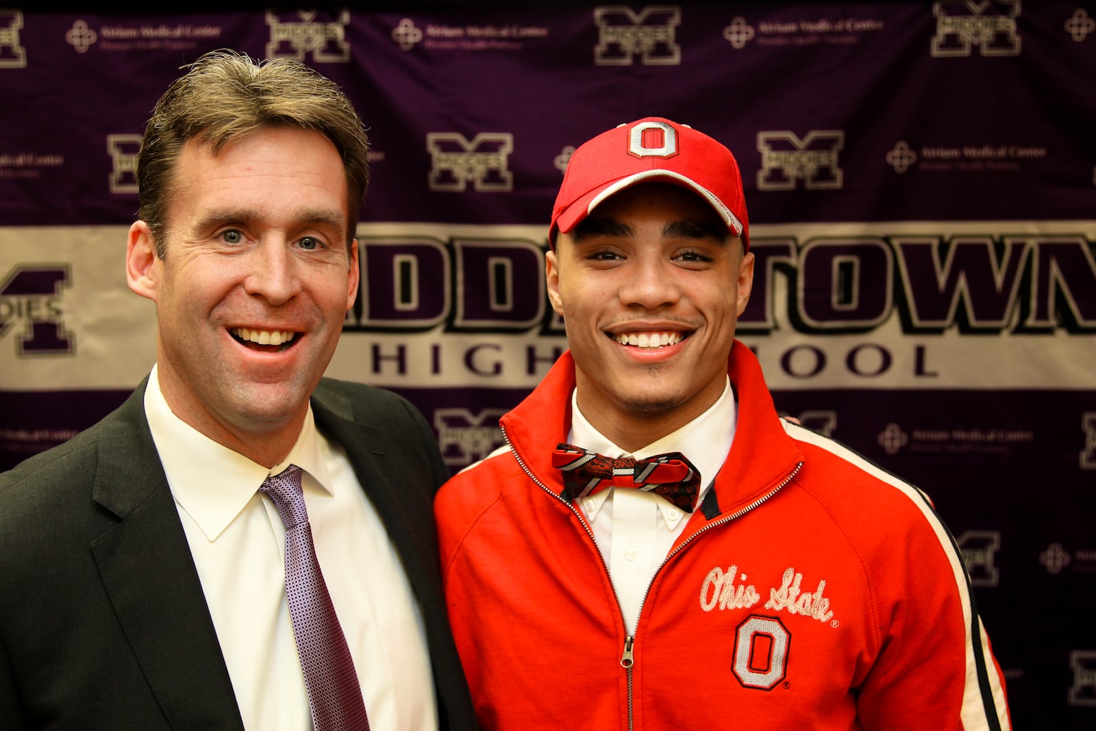 Jalin Marshall (right) stands with his football coach Troy Everhart during a National Signing Day event held at Middletown High School Wednesday, Feb. 6, 2013. Marshall committed to Ohio State to play football. Staff photo by Nick Daggy