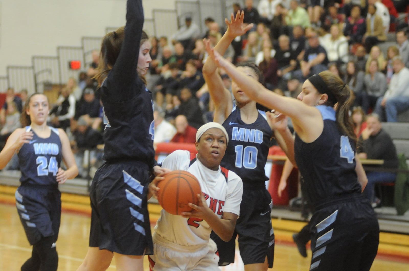 Nyla Hampton of Wayne (with ball) takes on three defenders. Mount Notre Dame defeated Wayne 48-28 in a girls high school basketball D-I district final at Princeton on Sat., March 3, 2018. MARC PENDLETON / STAFF