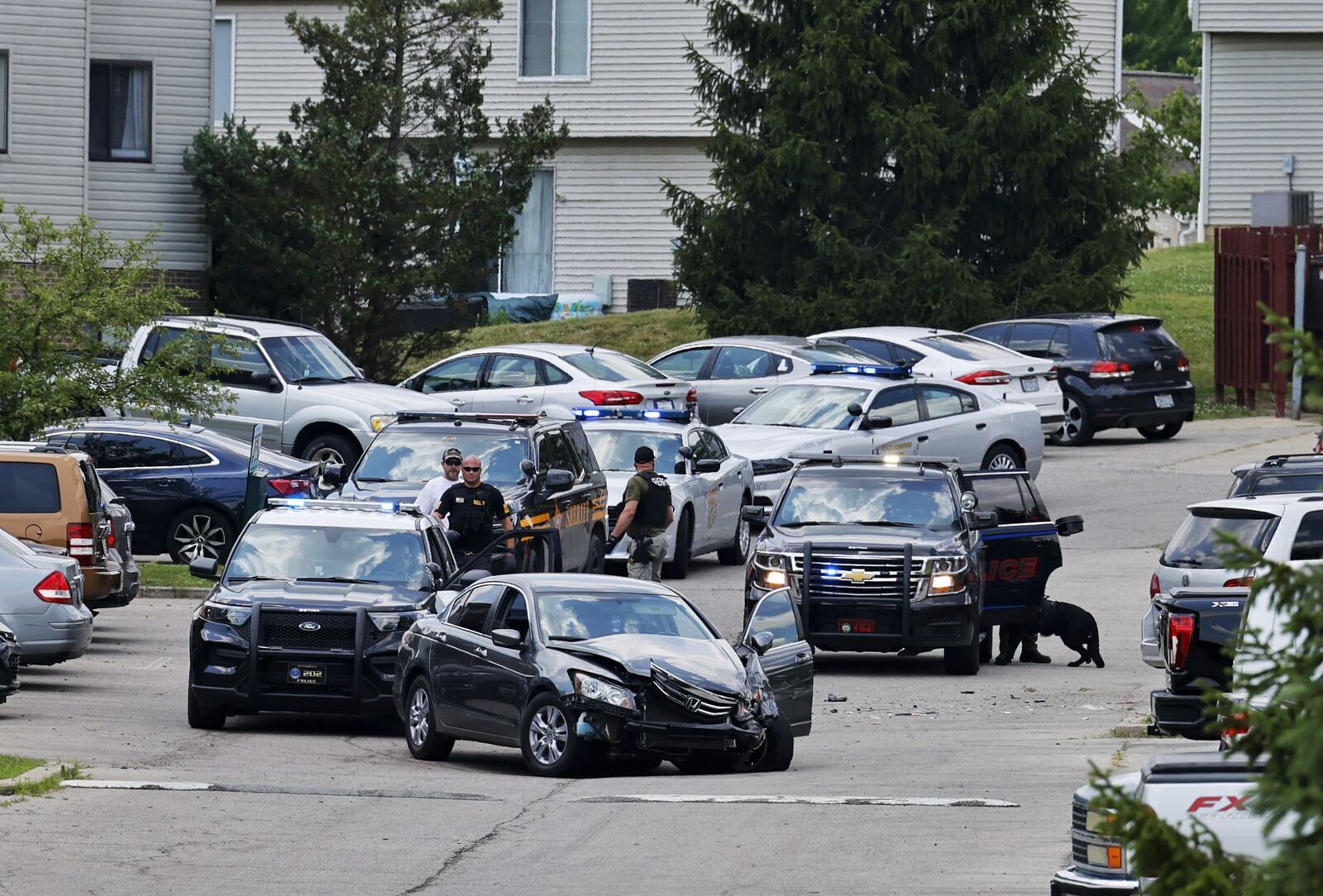 A Honda Accord involved in a pursuit from Franklin Wednesday, June 22, 2022, crashed into a minivan on Timbercreek Drive at a Springboro apartment complex. NICK GRAHAM/STAFF