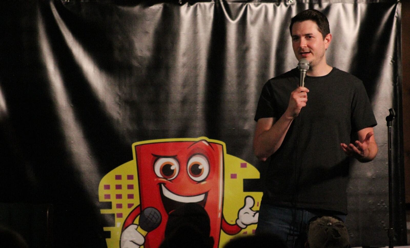 Kevin Ruppert, owner and founder of Bricky's Comedy Club, performs on stage. CONTRIBUTED