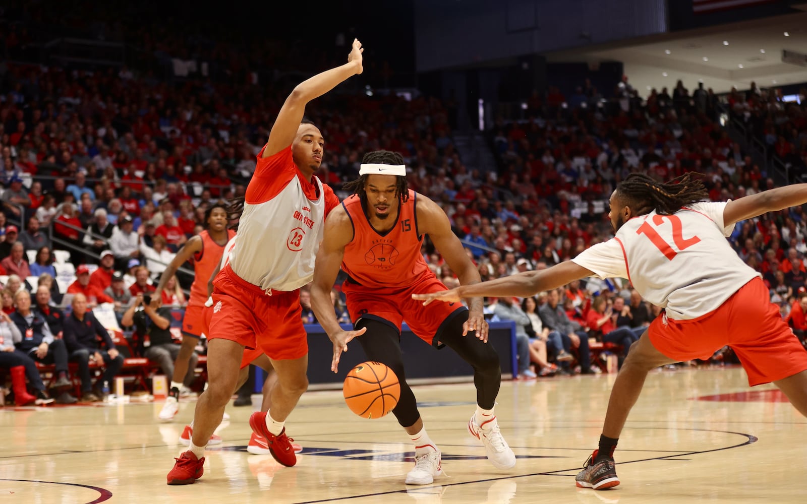 Ohio State's Zed Key, left, guards Dayton's DaRon Holmes II  during an exhibition on Sunday, Oct. 22, 2023, at UD Arena. David Jablonski/Staff