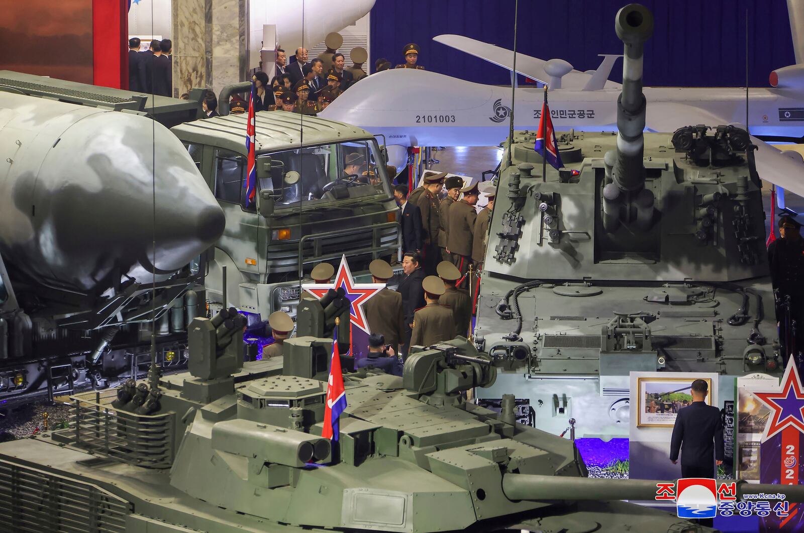 In this photo provided by the North Korean government, North Korean leader Kim Jong Un, center, looks around at a defense exhibition in Pyongyang, North Korea Thursday, Nov. 21, 2024. Independent journalists were not given access to cover the event depicted in this image distributed by the North Korean government. The content of this image is as provided and cannot be independently verified. Korean language watermark on image as provided by source reads: "KCNA" which is the abbreviation for Korean Central News Agency. (Korean Central News Agency/Korea News Service via AP)