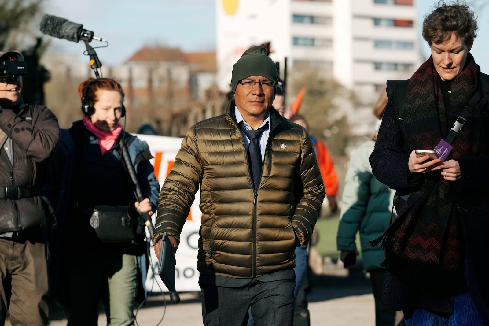 Peruvian farmer Luciano Lliuya arrives at the Higher Regional Court in Hamm, Germany, for a first hearing of his climate damages case against the German energy company RWE for its carbon emissions, which may have been contributing to the melting of a nearby glacier that could flood his home, Monday, March 17, 2025. (AP Photo/Martin Meissner)