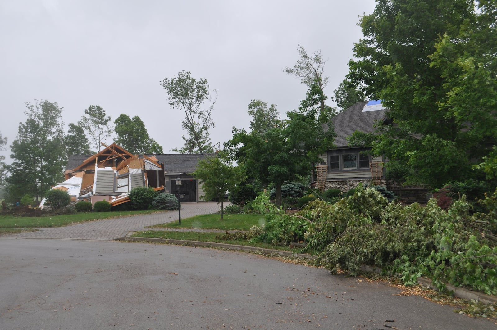 A view of Mike Roberts’ house on Charlie Court in Brookville. A tornado destroyed Roberts’ garage and damaged his house Monday night.