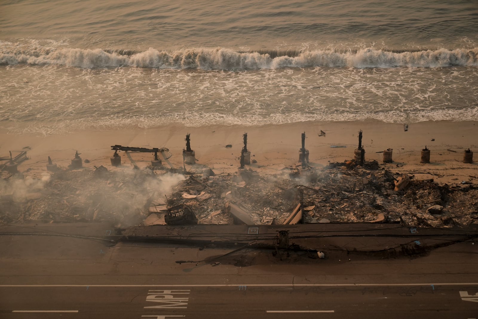 Beach front properties are burned to the ground by the Palisades Fire Thursday, Jan. 9, 2025 in Malibu, Calif. (AP Photo/Jae C. Hong)