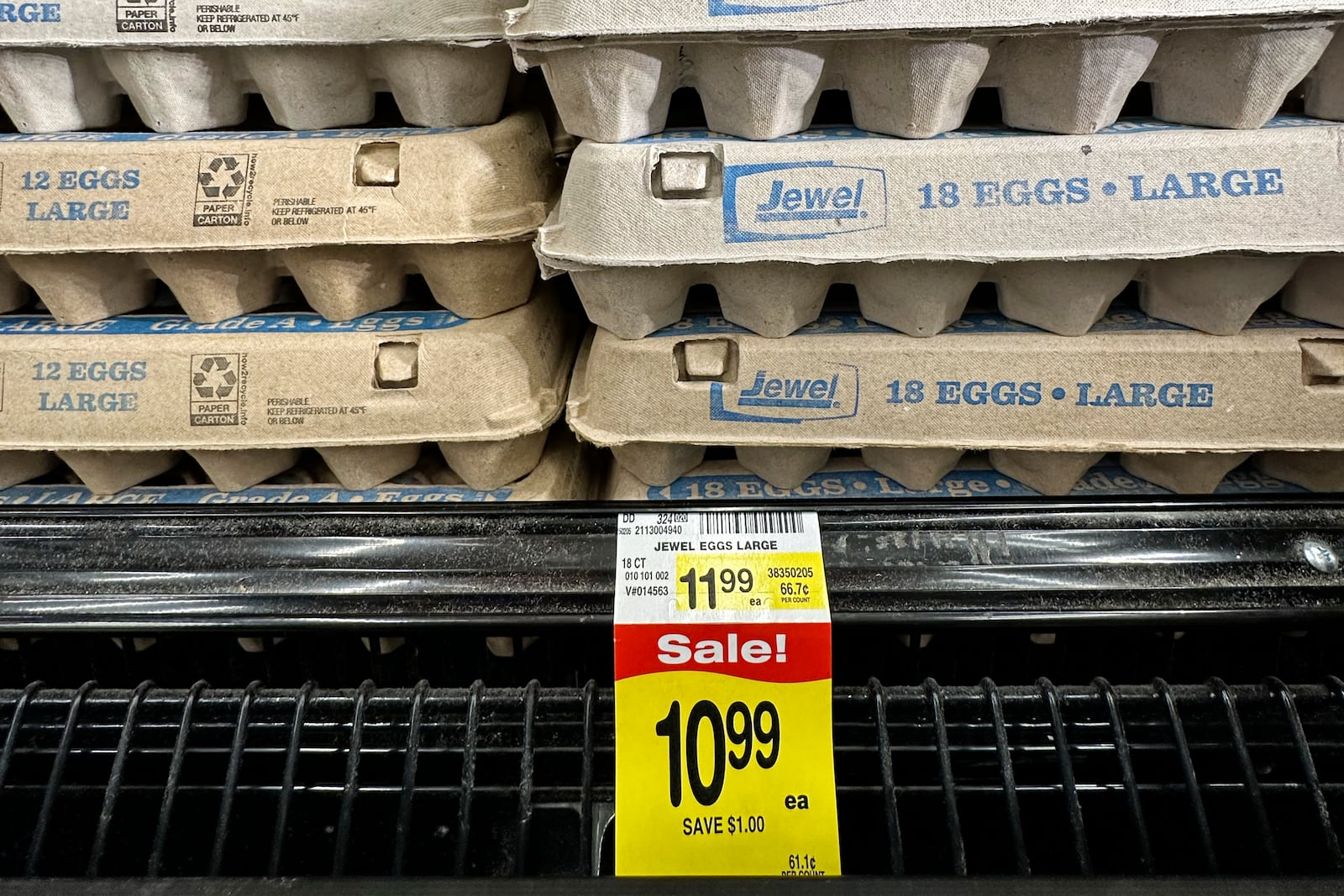 FILE - The eggs price is displayed on the edge of a shelf at a grocery store in Glenview, Ill., Monday, Feb. 10, 2025. (AP Photo/Nam Y. Huh, File)