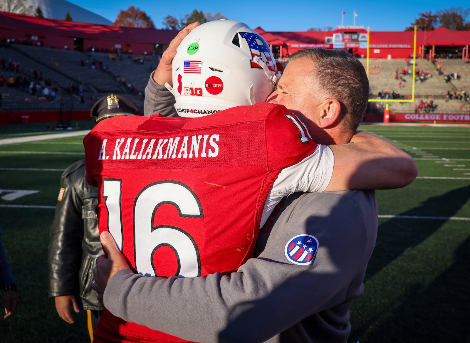 Rutgers quarterback Athan Kaliakmanis (16) has an emotional moment with head coach Greg Schiano after the Scarlet Knights beat Minnesota 26-19 in an NCAA college football game, Saturday, Nov. 9, 2024, in Piscataway, N.J. Kaliakmanis transferred from Minnesota to play at Rutgers this season. (Andrew Mills/NJ Advance Media via AP)