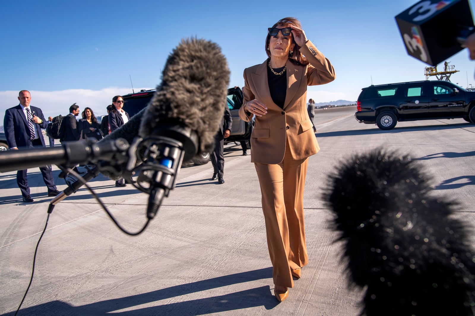 Democratic presidential nominee Vice President Kamala Harris walks toward reporters to speak before boarding Air Force Two, as she departs Las Vegas from Harry Reid International Airport, Thursday, Oct. 10, 2024, en route to Arizona. (AP Photo/Jacquelyn Martin)