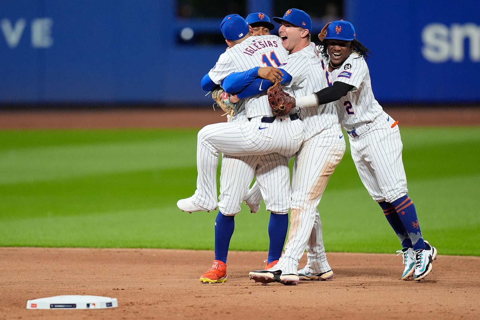 The New York Mets celebrate after defeating the Philadelphia Phillies in Game 4 of the National League baseball playoff series, Wednesday, Oct. 9, 2024, in New York. (AP Photo/Frank Franklin II)