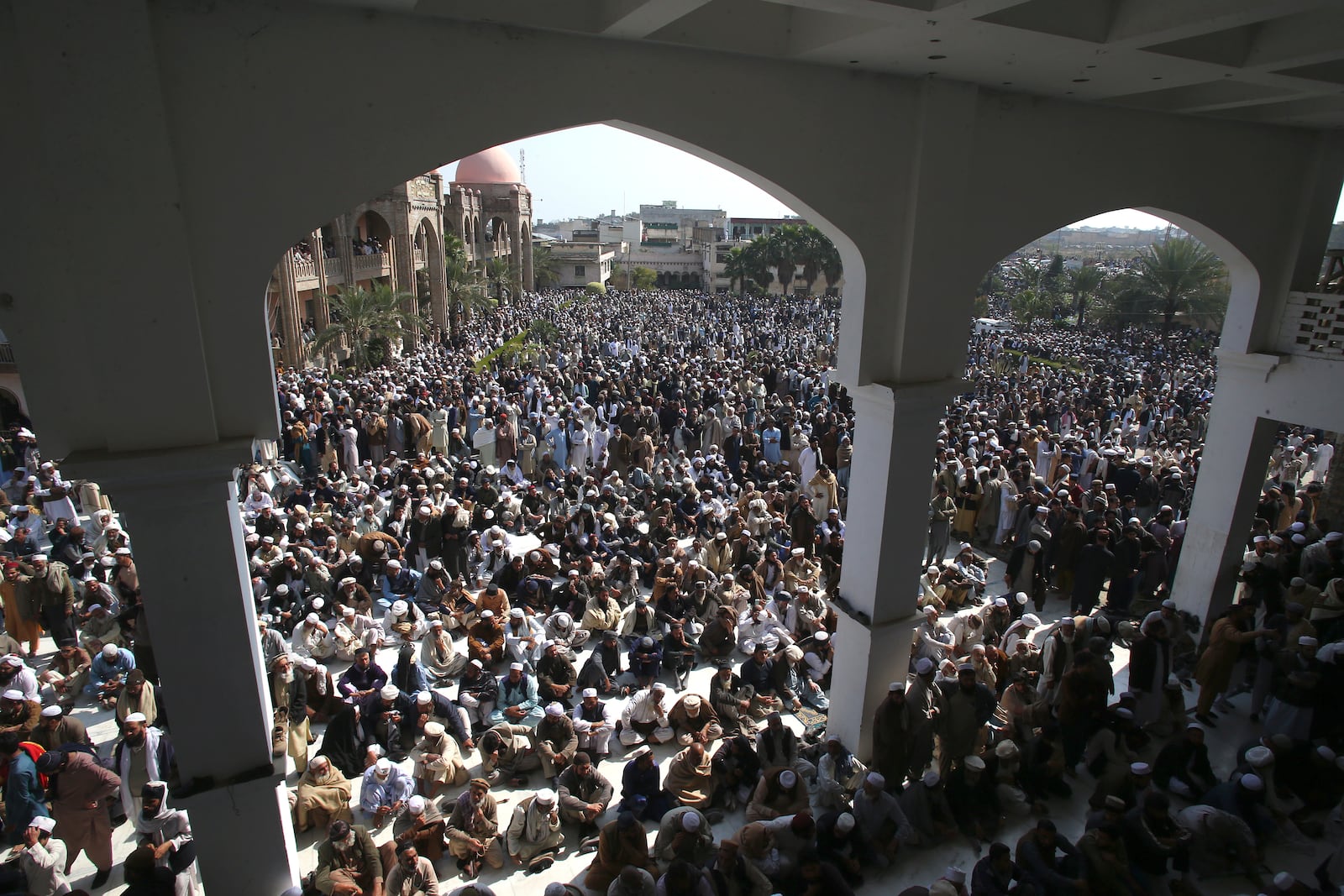 Mourners attend the funeral prayer of a senior Muslim cleric, Hamidul Haq who was killed in the Friday's suicide bomb attack at a pro-Taliban seminary in Akora Khattak, Pakistan, Saturday, March 1, 2025. (AP Photo/Muhammad Sajjad)