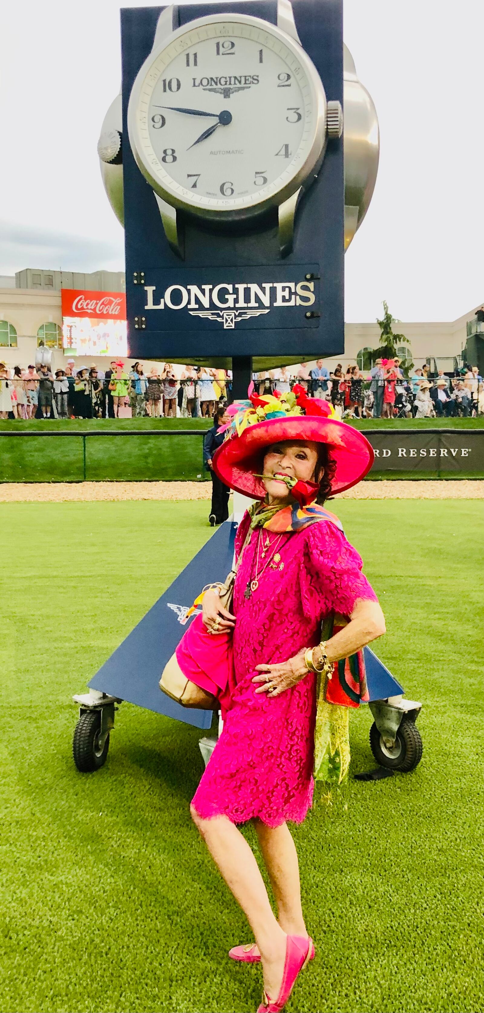 Helen Stevens-Gleason, who, along with her husband, Rick Stevens-Gleason, own 200 shares of Mage, winner of the 2013 Kentucky Derby, celebrates with a red rose in her mouth. She was given the rose by Mage's jockey, . SUBMITTED PHOTO