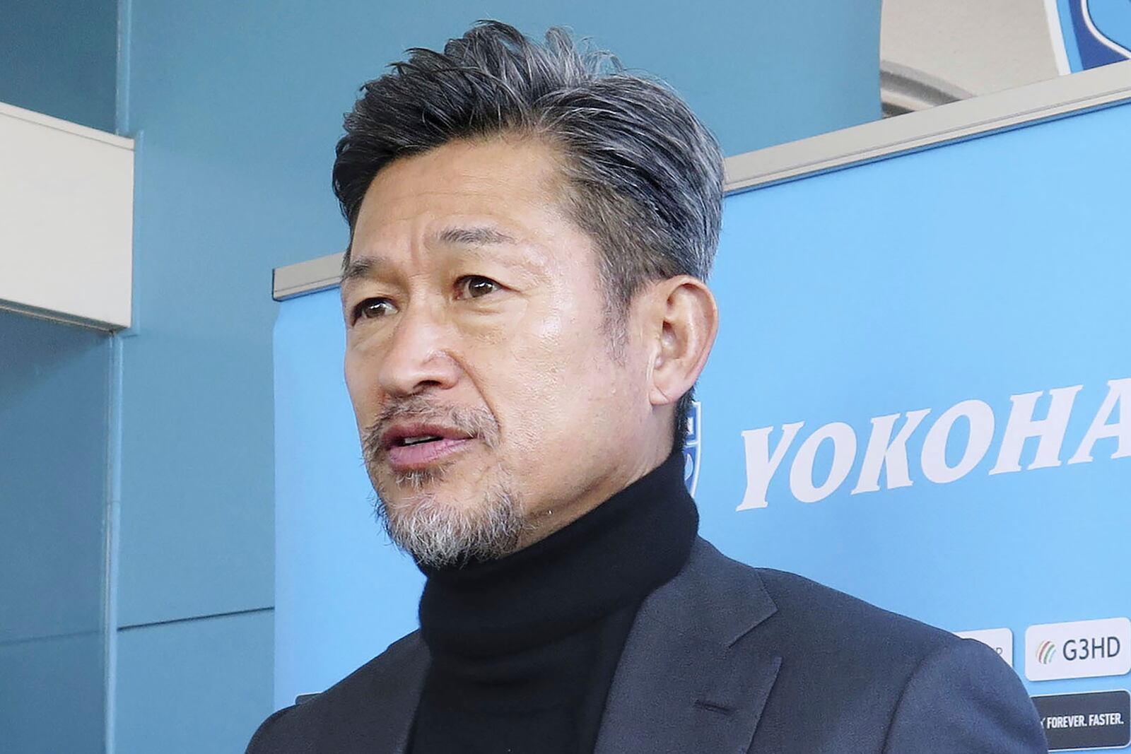 Japanese forward Kazuyoshi Miura speaks to reporters in Yokohama, south of Tokyo, on Jan. 11, 2025. (Kyodo News via AP)