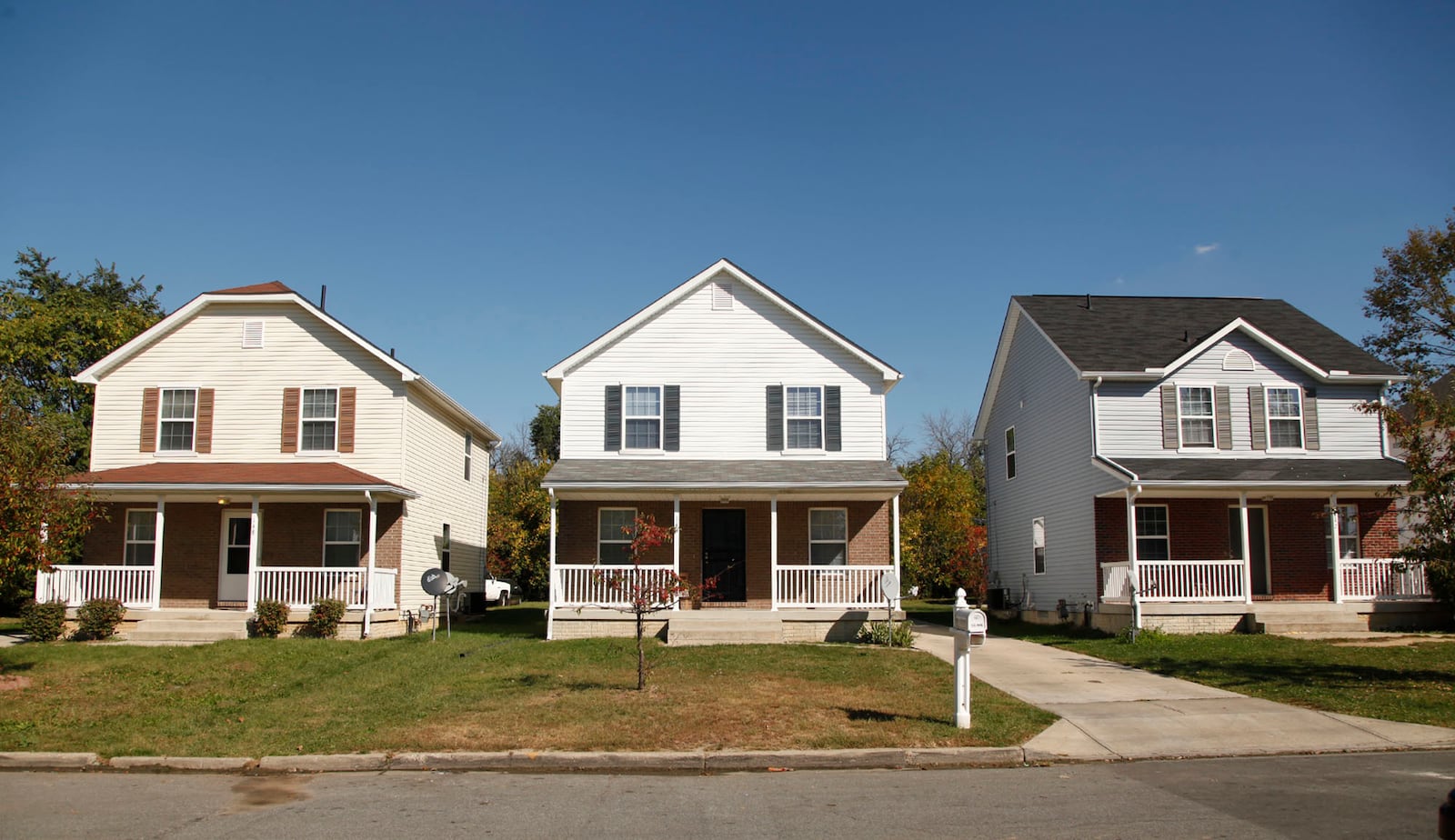 These rental homes on Crown Ave. in Trotwood are a bright spot in a neighborhood full of empty lots and dilapidated homes in a neighborhood that has seen a 57% drop in the median value of residential properties. TY GREENLEES / STAFF