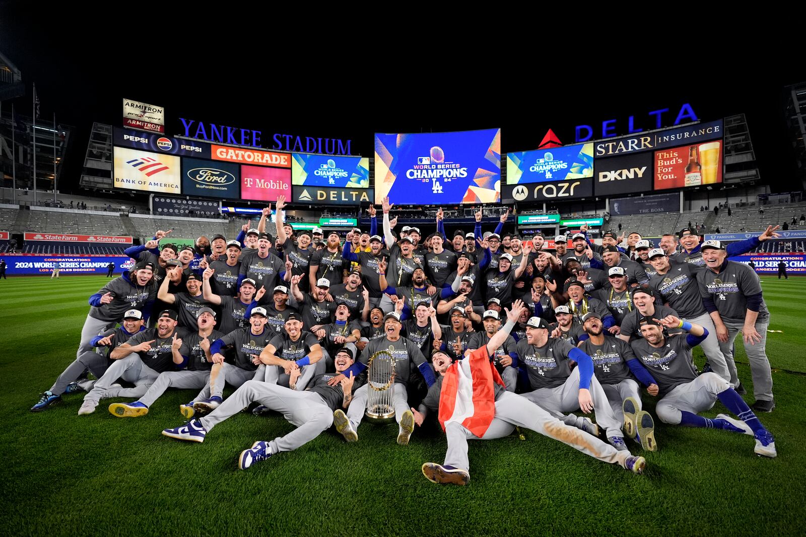 The Los Angeles Dodgers pose for a team picture after their win against the New York Yankees in Game 5 to win the baseball World Series, Thursday, Oct. 31, 2024, in New York. (AP Photo/Ashley Landis)