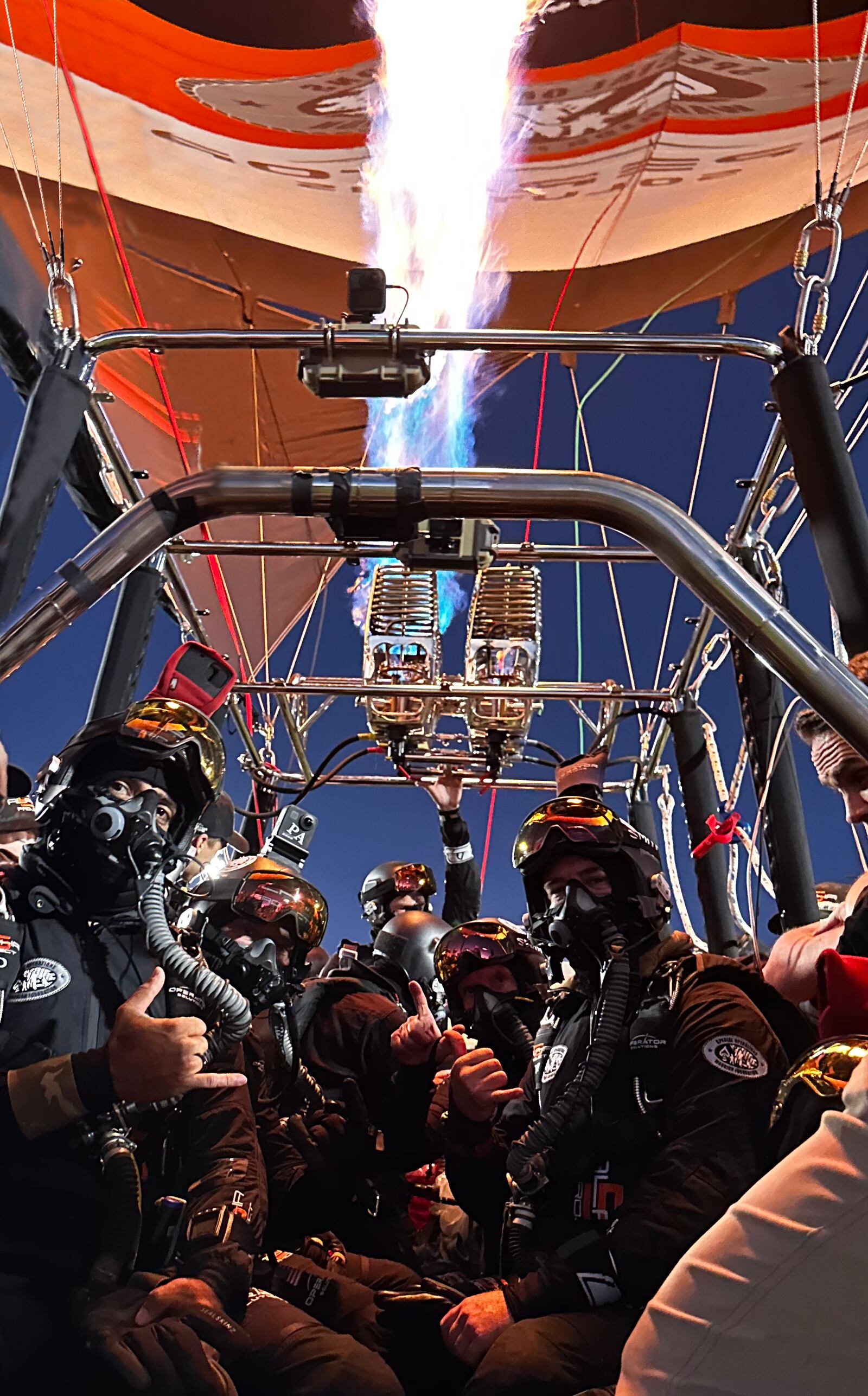 In the balloon basket in Roswell, New Mexico, before the ascent to 38,067 feet. From left: MSgt. Rob Dieguez, MSgt. (Ret) Jimmy Petrolia, CMSgt. (Ret) Chris Lais, Larry Connor and CMSgt. Brandon Daugherty. Far back is balloon pilot Shane Wallace. Samantha Montanez/CONTRIBUTED